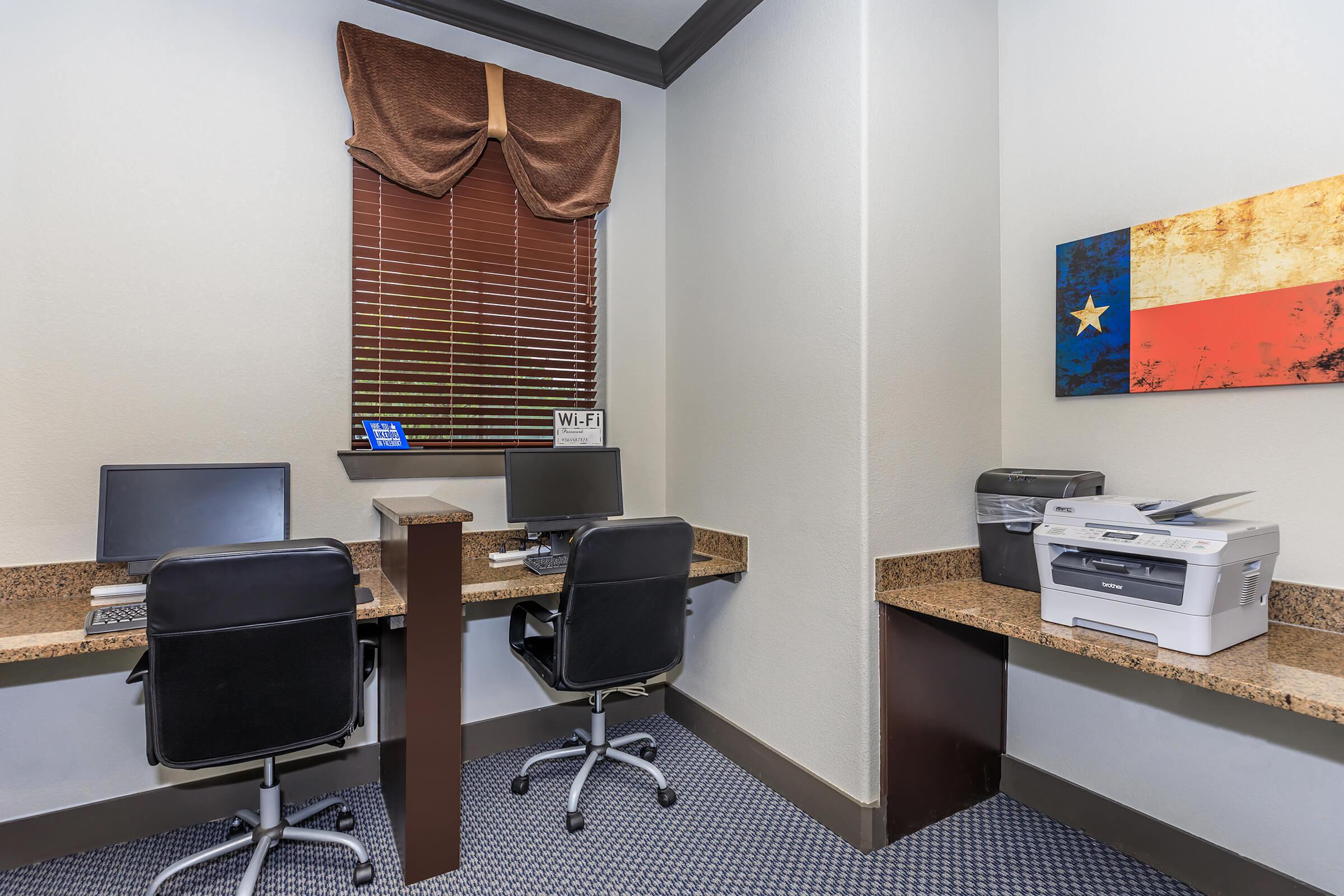 a desk with a chair in a room