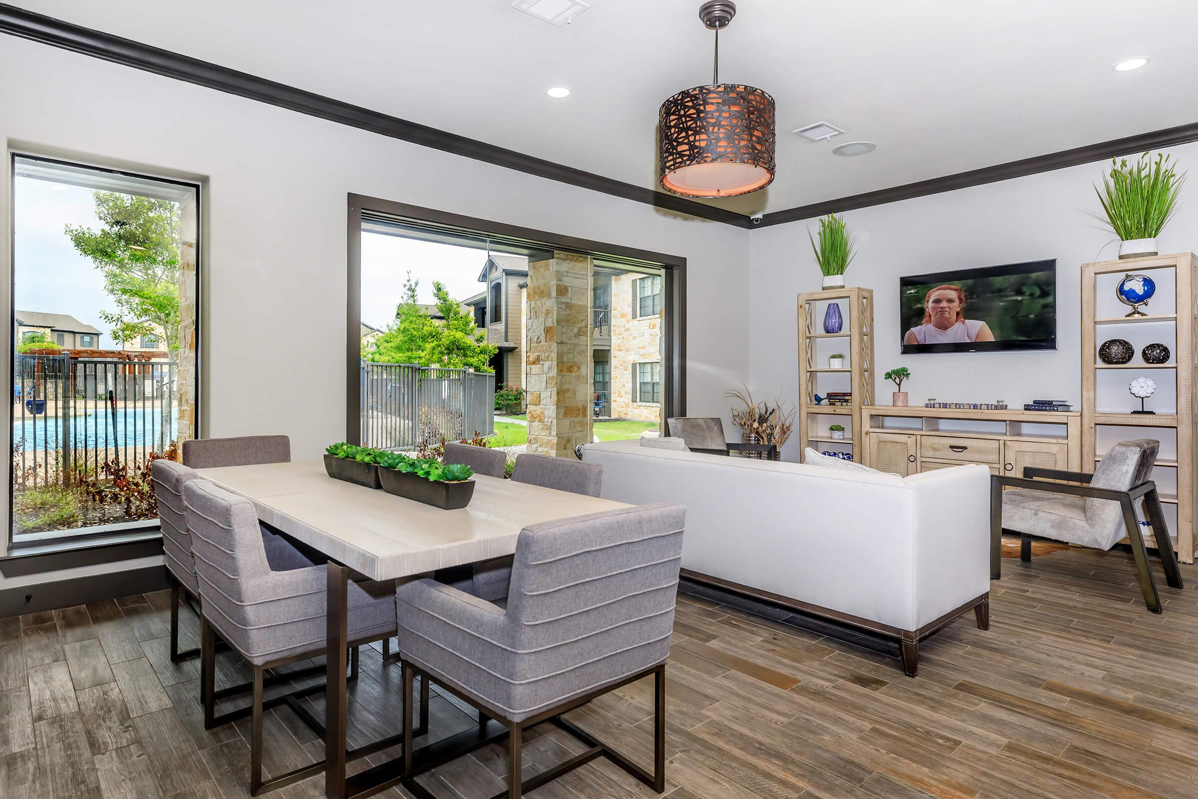 a room filled with furniture and a large window