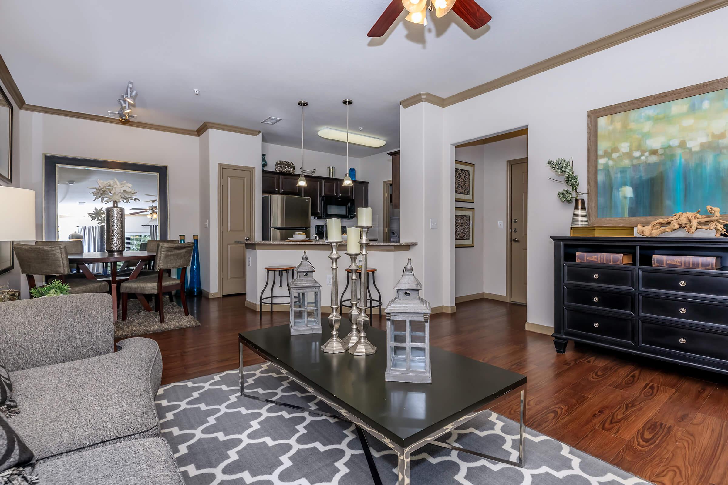 a living room filled with furniture and a fire place