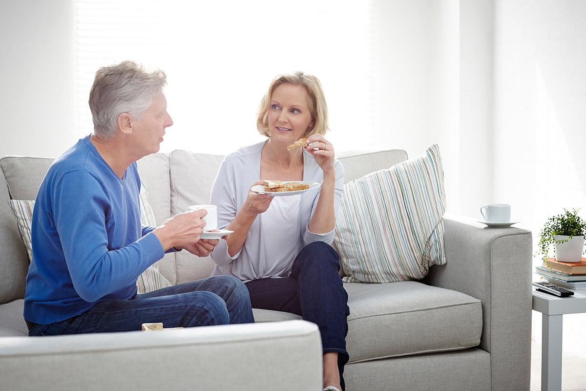 a man and a woman sitting on a couch