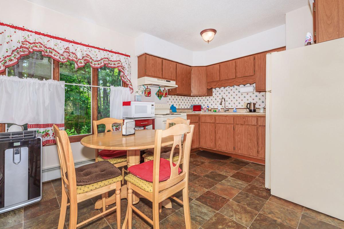 a kitchen with a dining room table