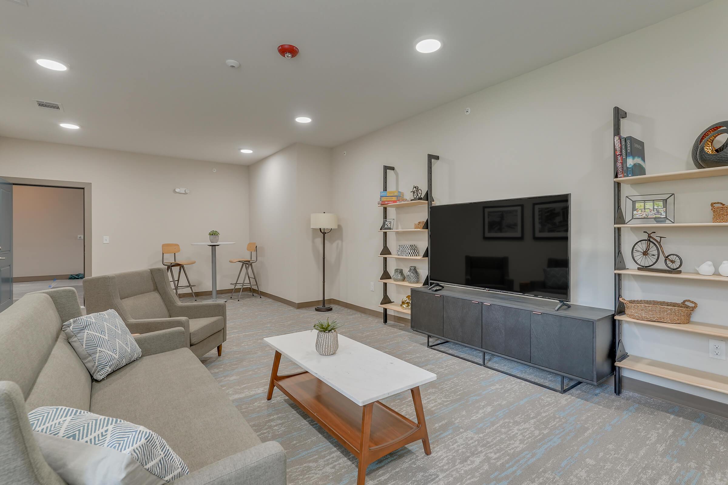 a living room filled with furniture and a fireplace