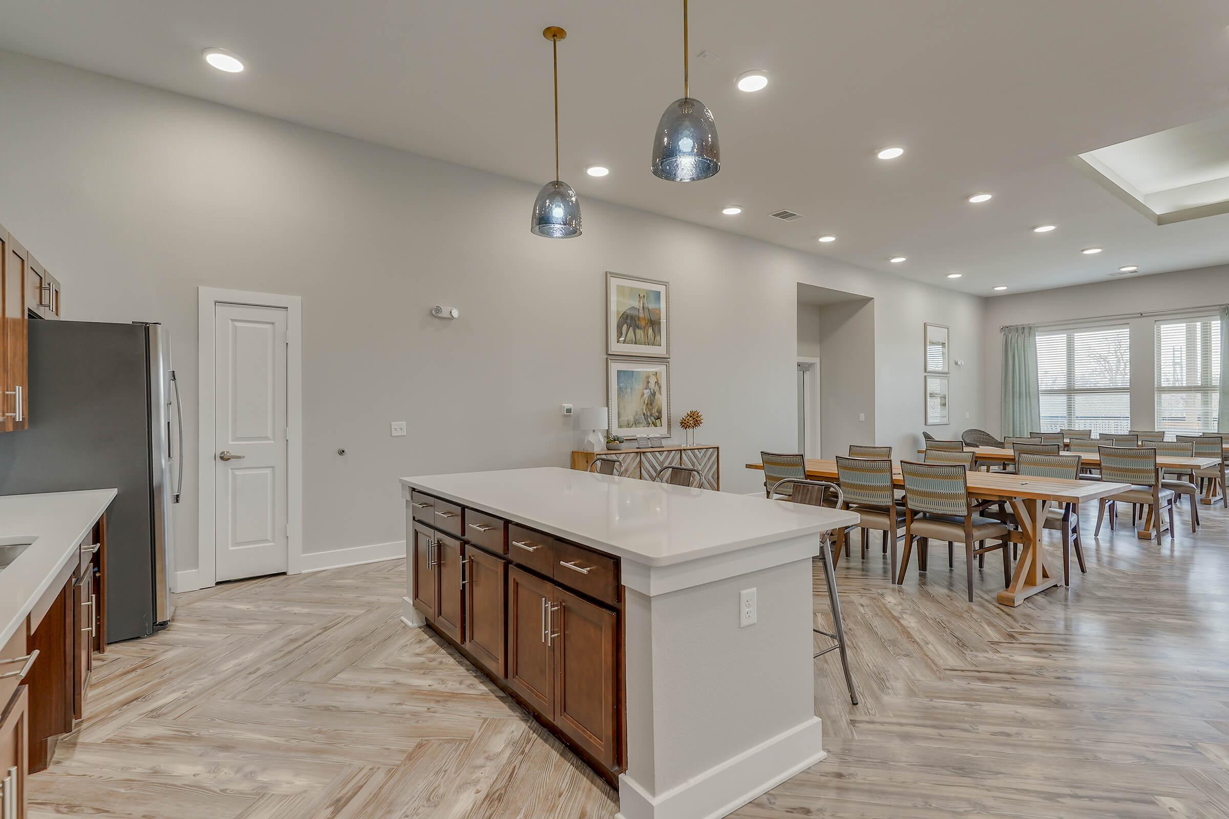 a kitchen with a table in a room
