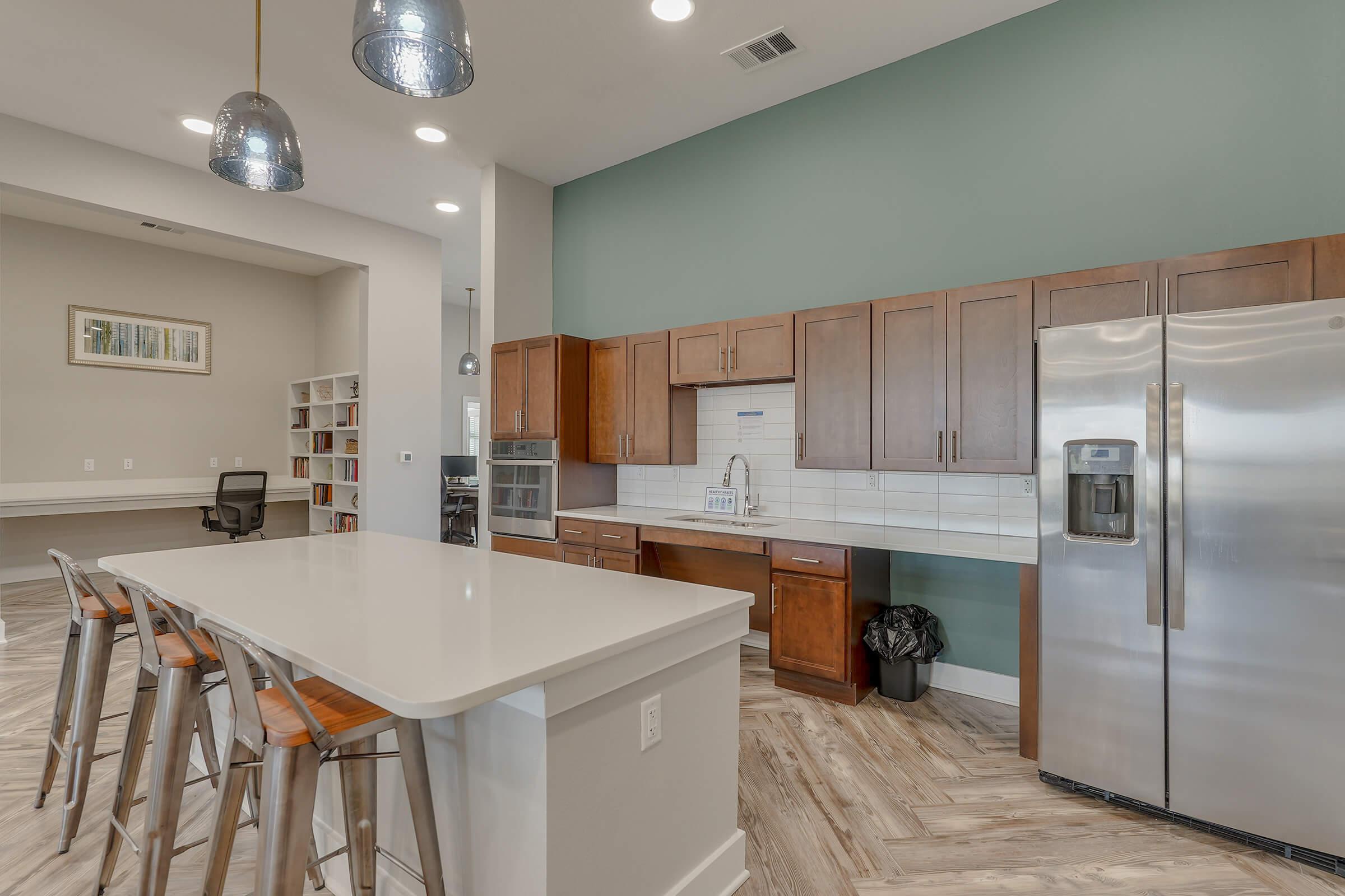 a stainless steel refrigerator in a kitchen