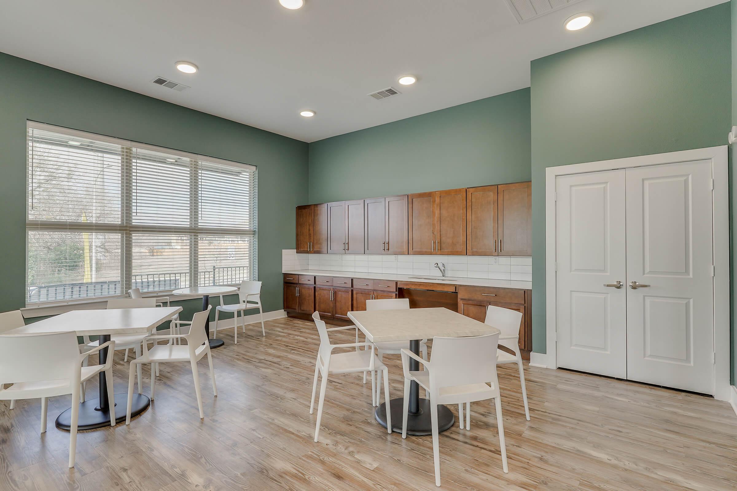 a room filled with furniture and a large window