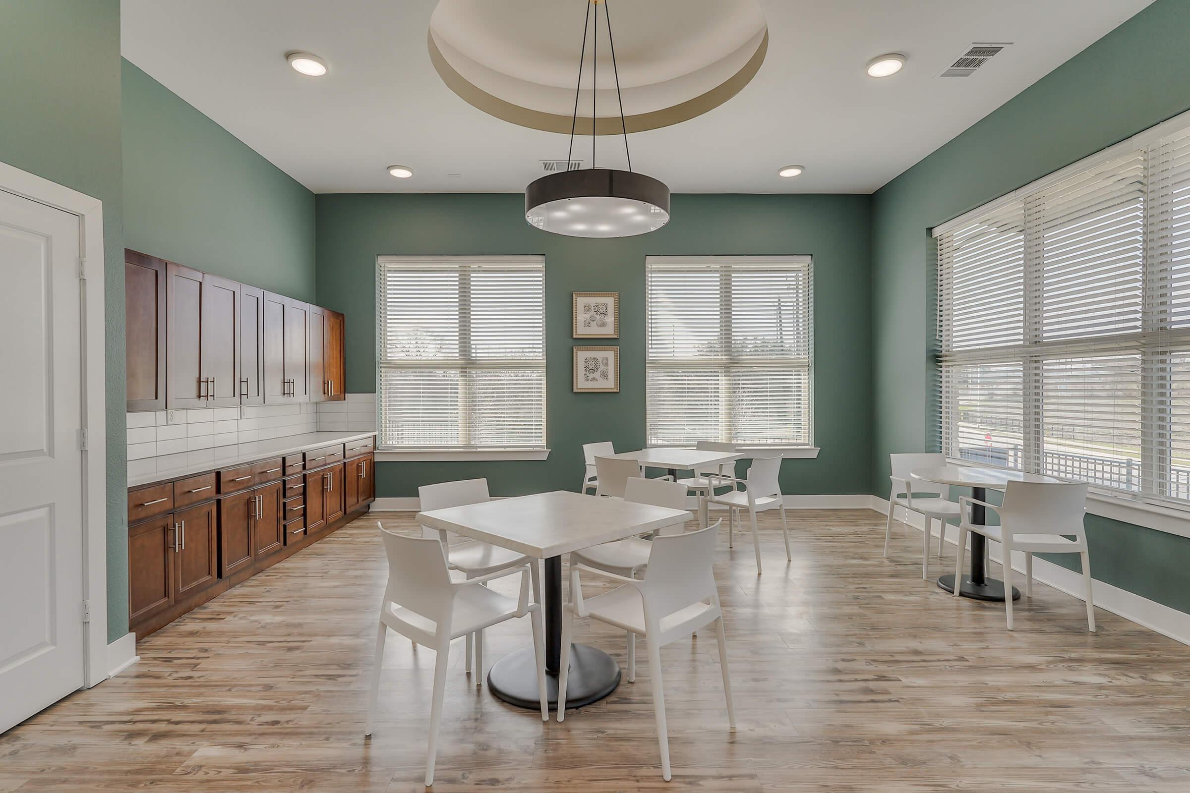 a room filled with furniture and a large window