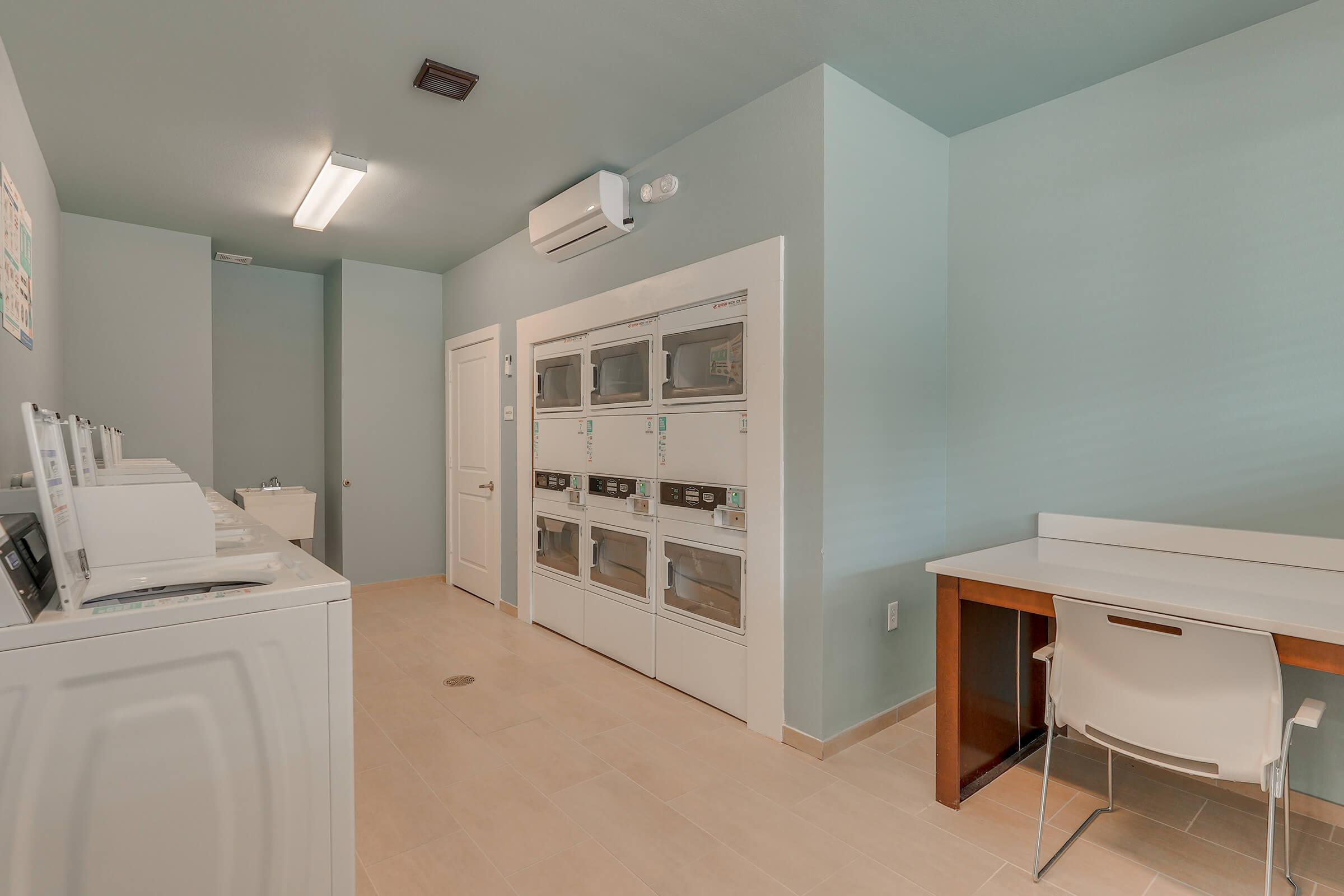 a room with a sink and a mirror