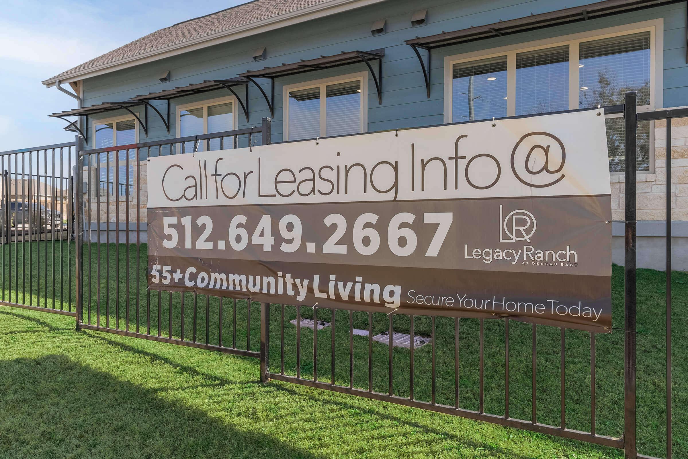 a sign on the side of a fence