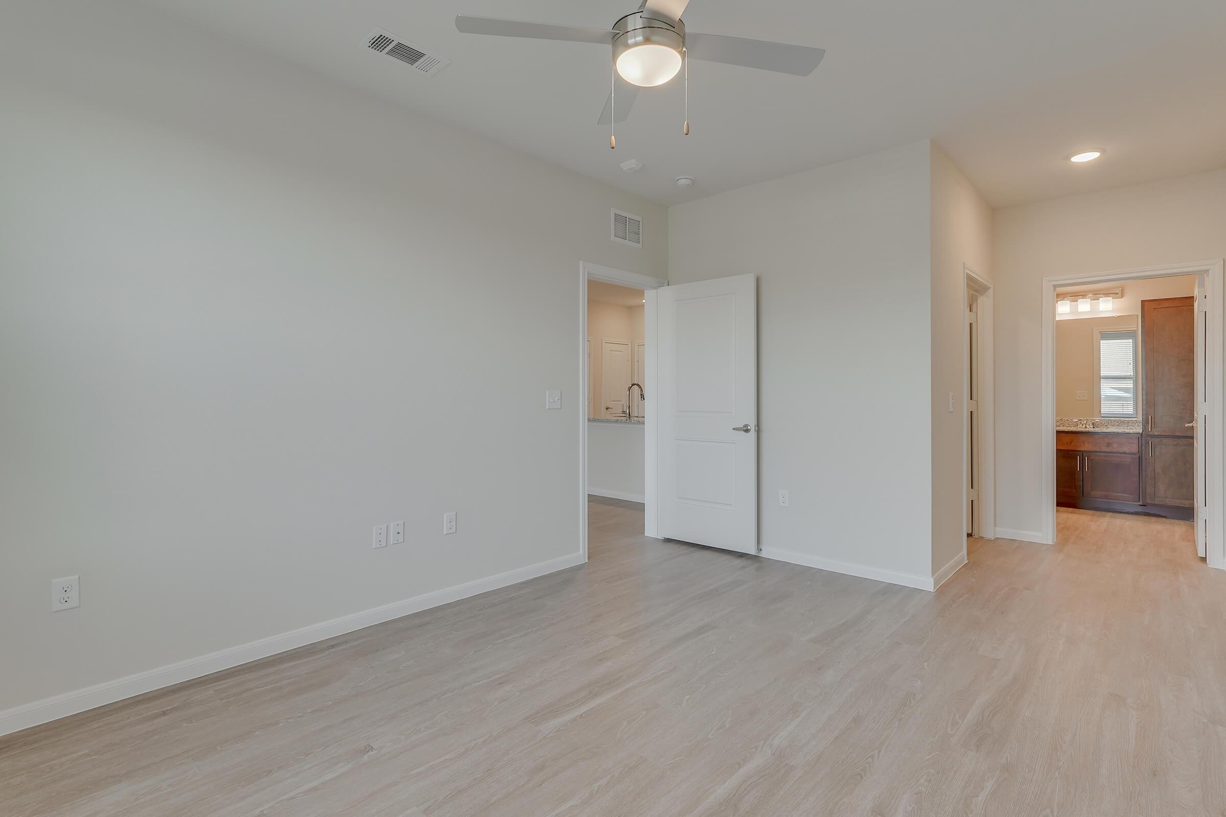 Legacy Ranch at Dessau East Apartments in Pflugerville TX With Hardwood Flooring, White Walls, With Access to the Bathroom