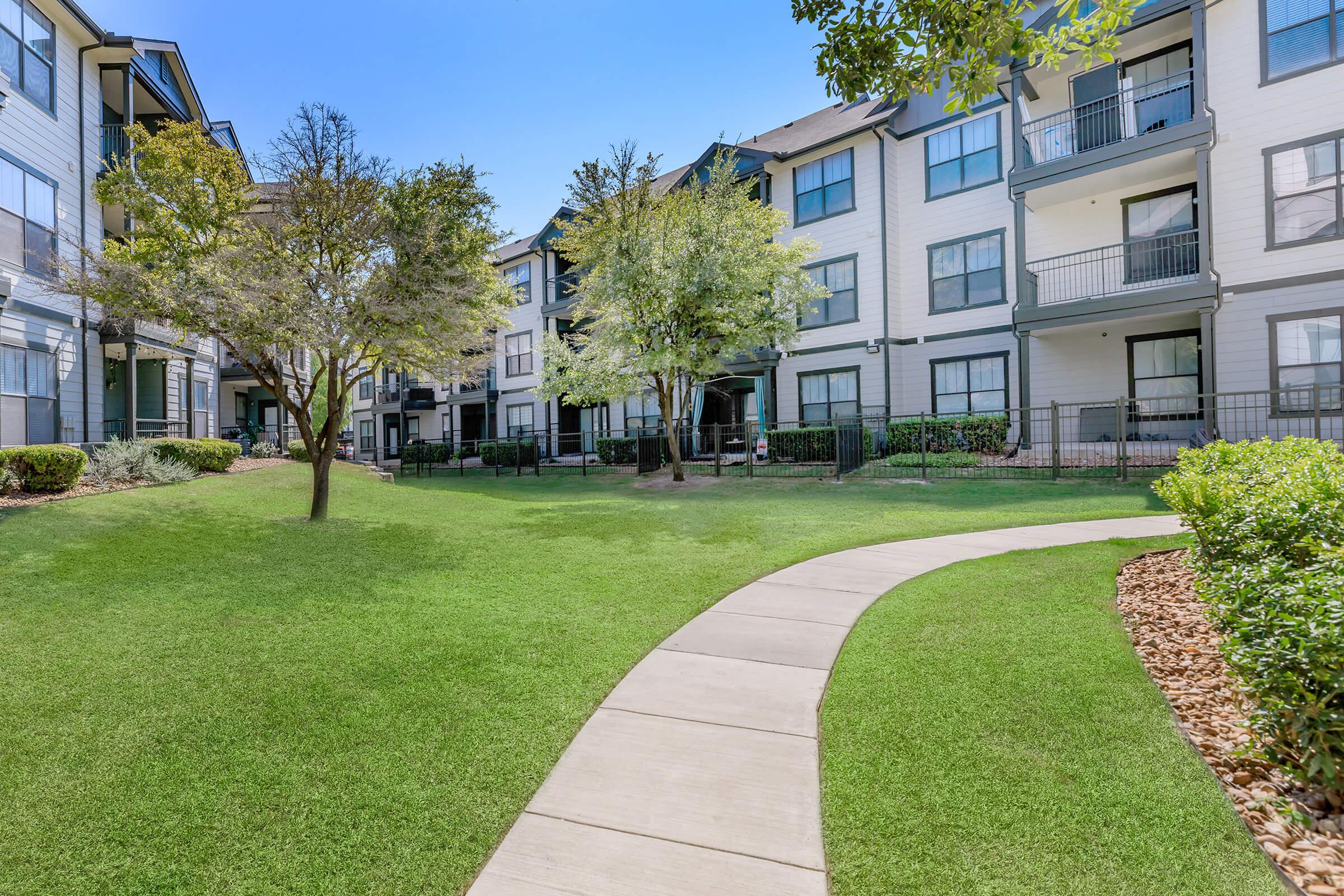 a large lawn in front of a building