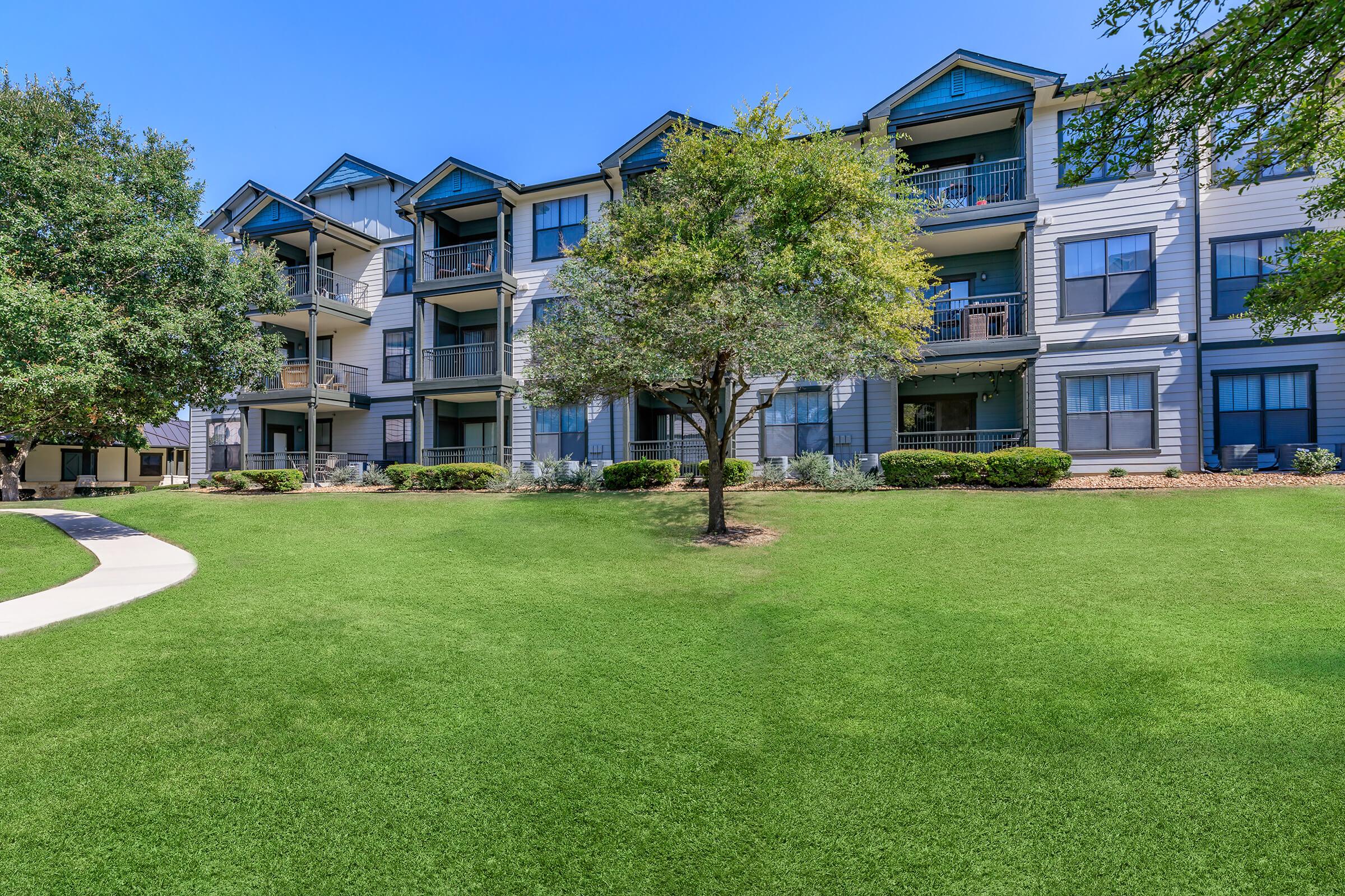 a large lawn in front of a building