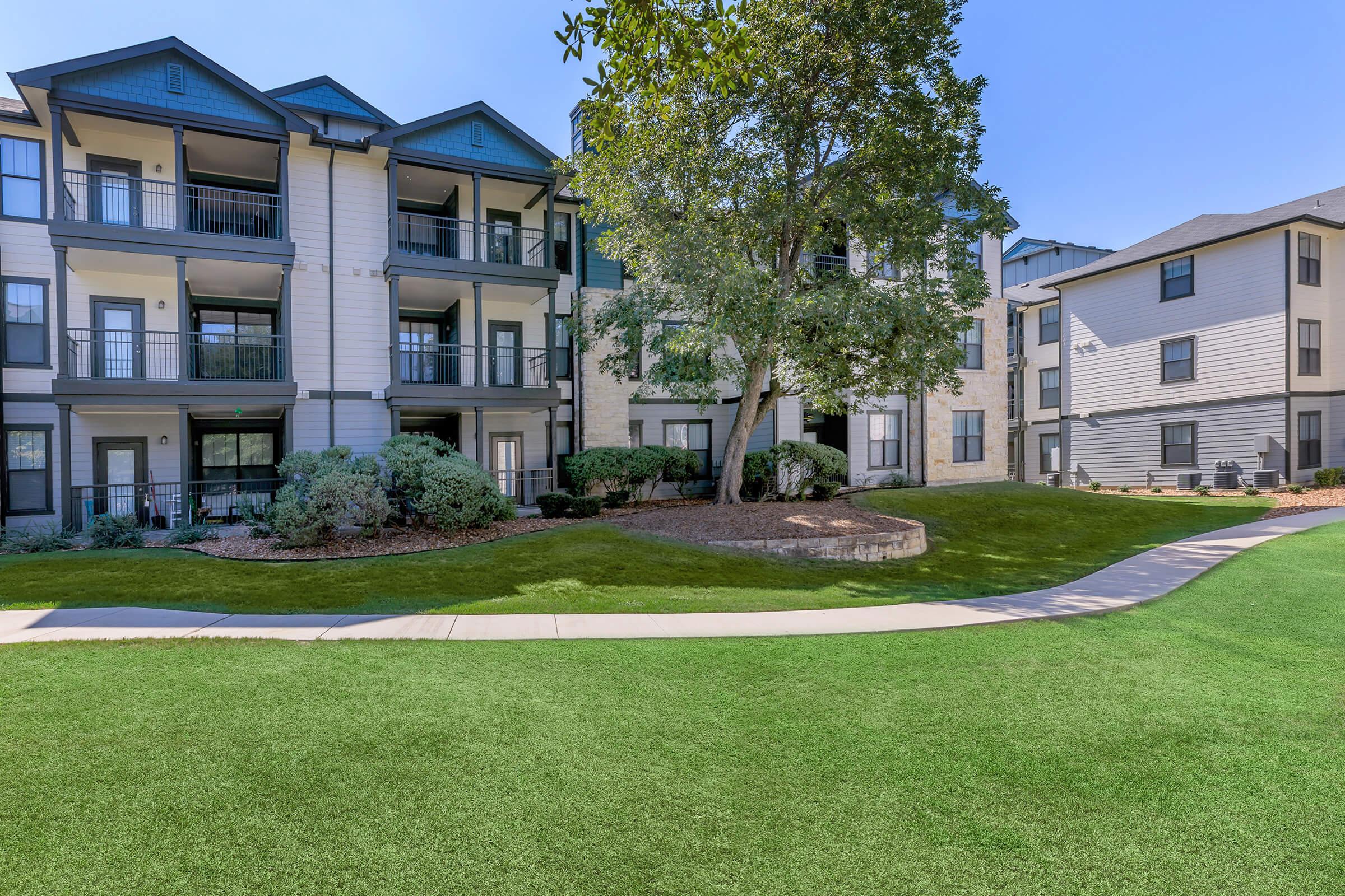 a large lawn in front of a house