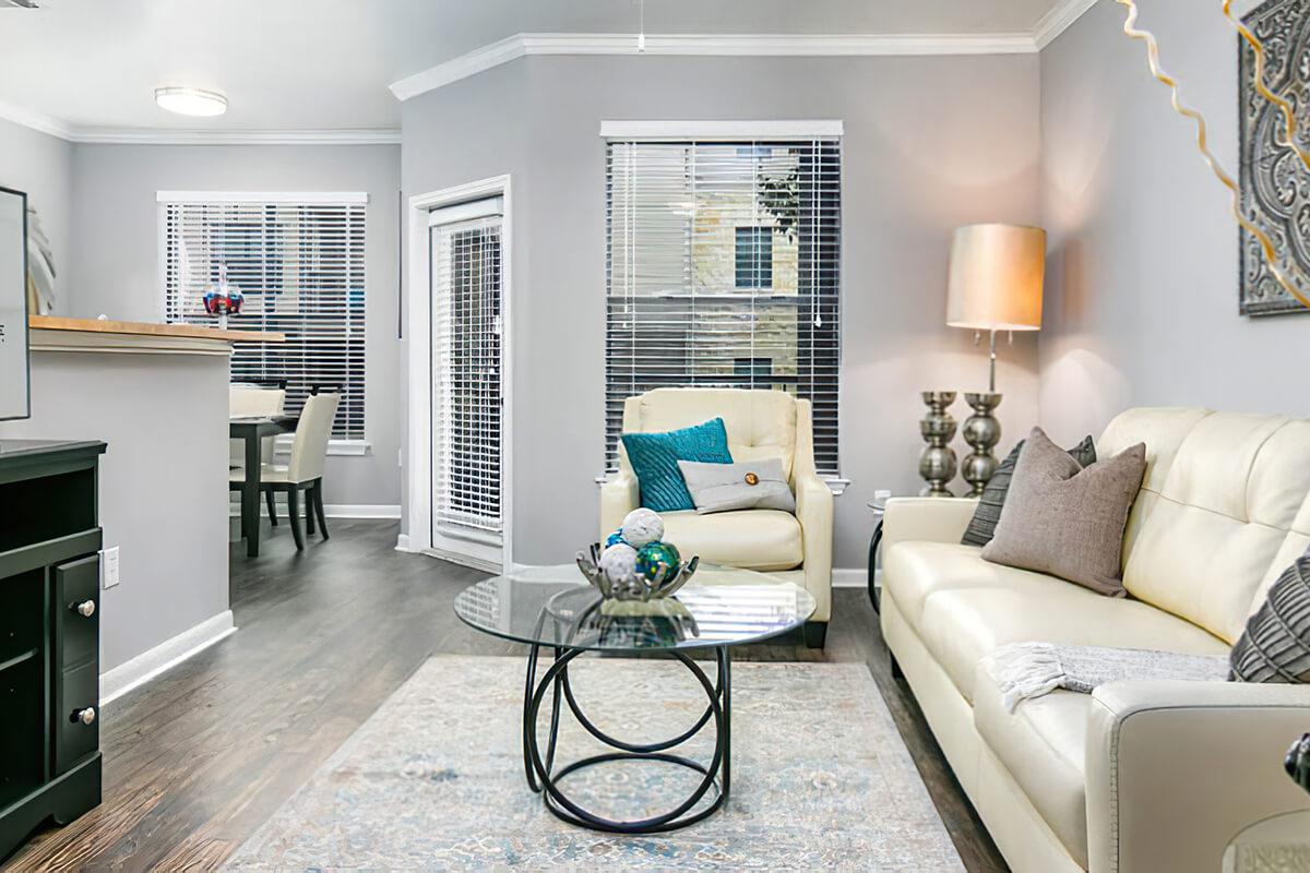 a living room filled with furniture and a flat screen tv