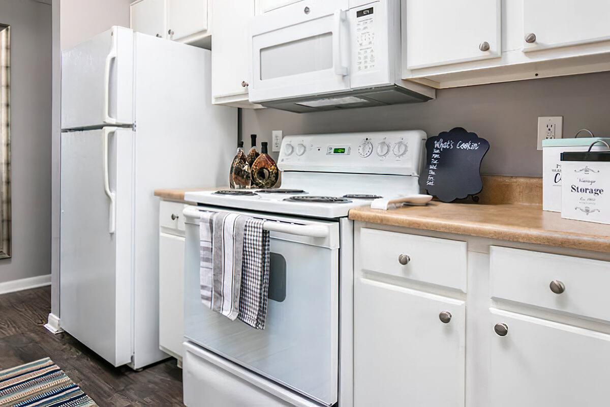 a kitchen with a stove top oven sitting inside of a refrigerator