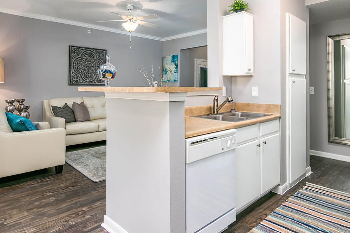 a room filled with furniture and a sink