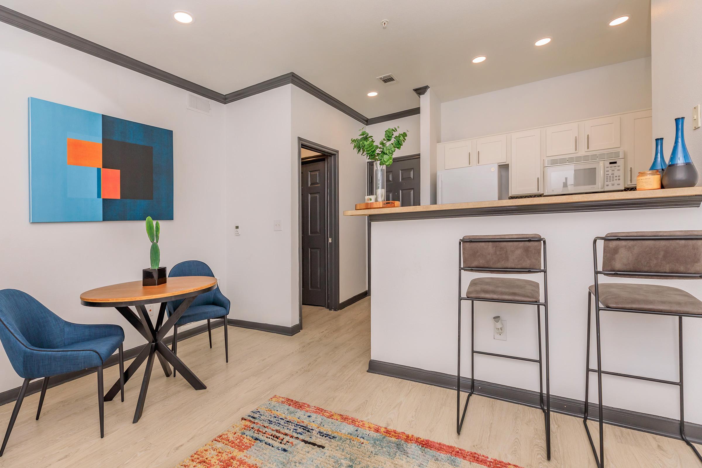 a living room filled with furniture and a tv