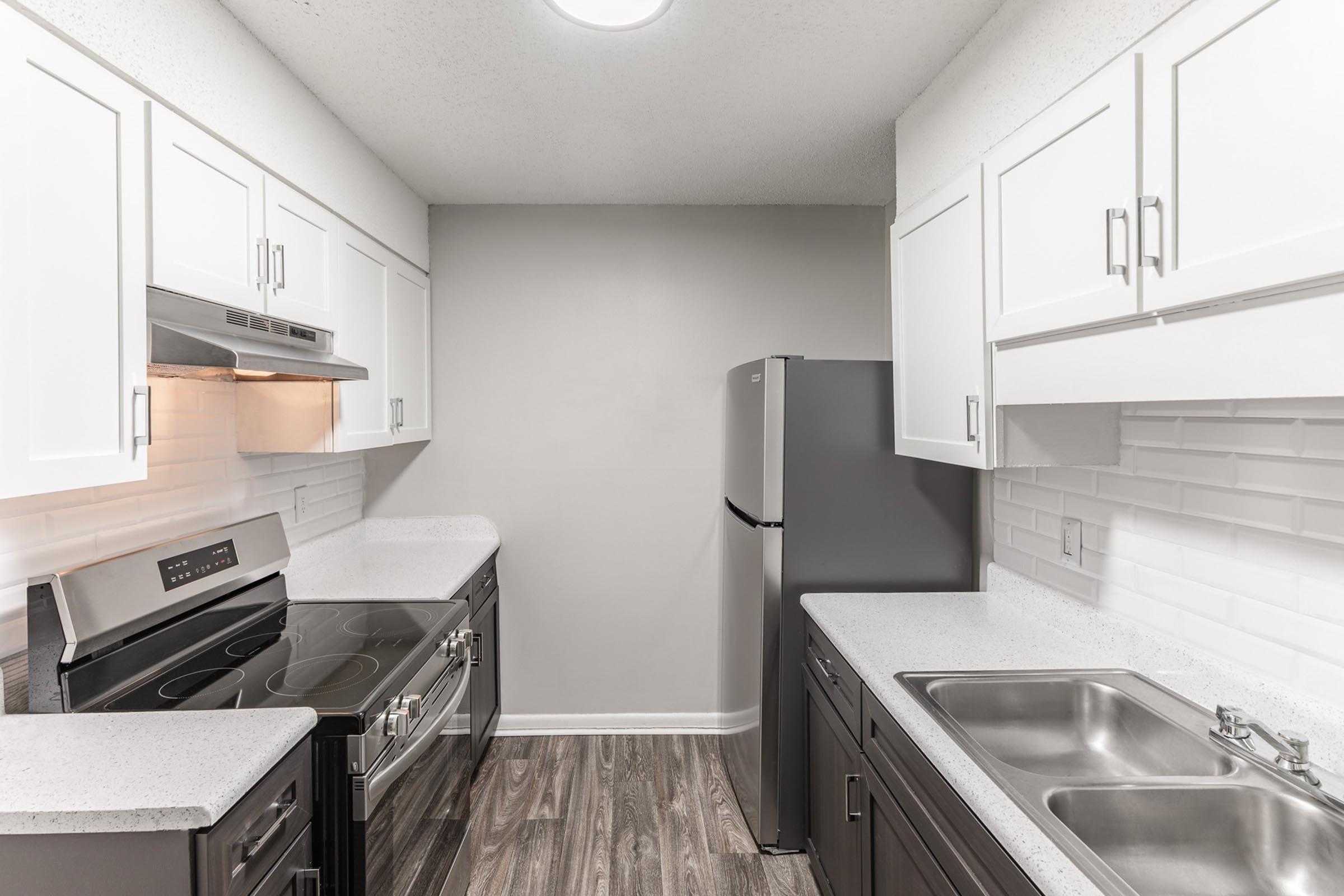 a kitchen with a sink and a microwave