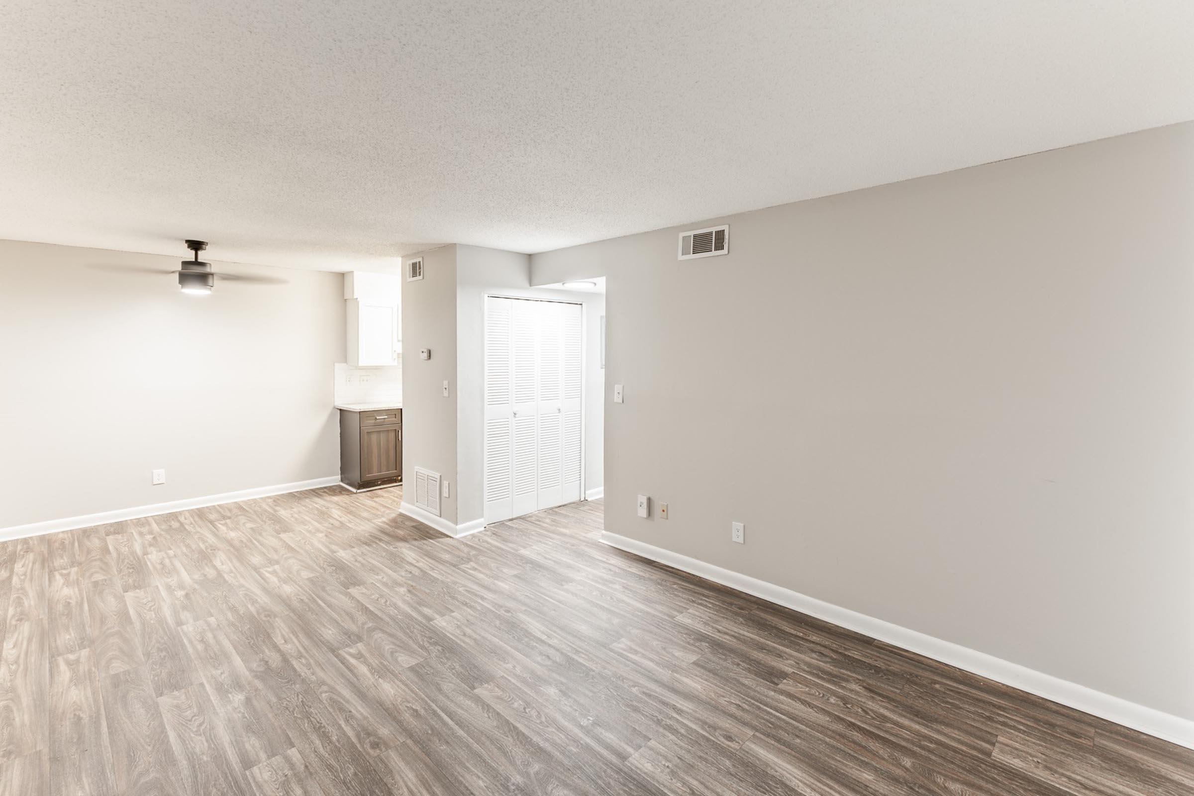 a bedroom with a wooden floor