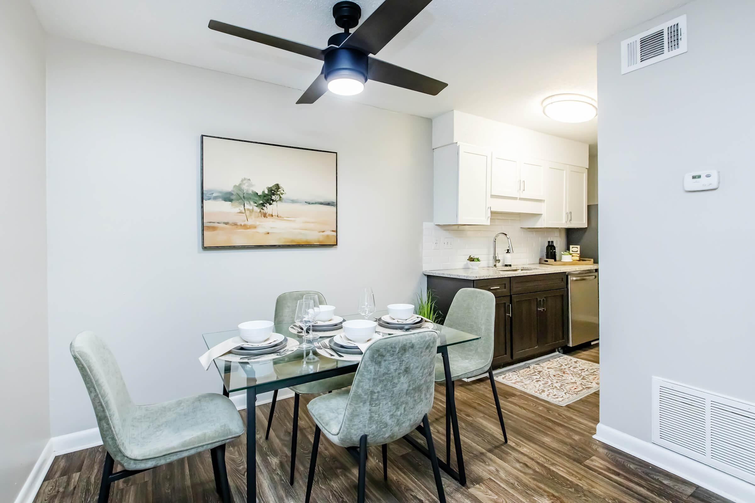 a living room filled with furniture and a table