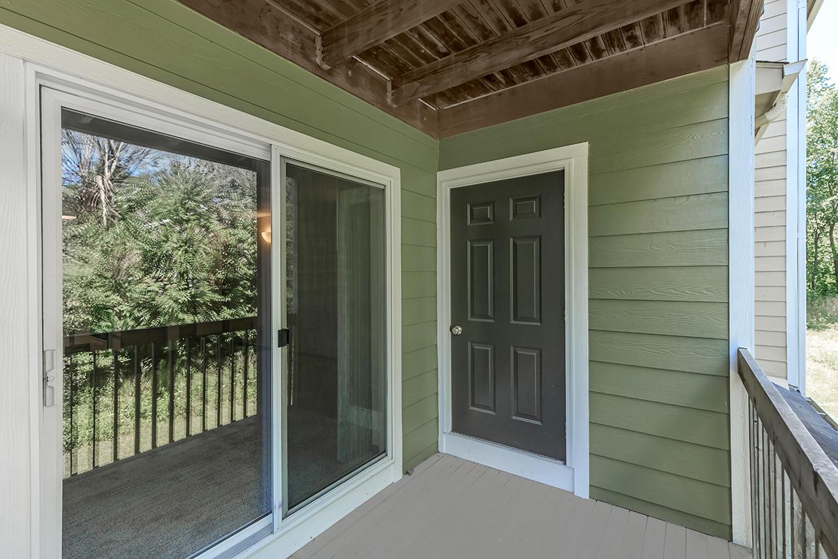 a door with a window in a brick building