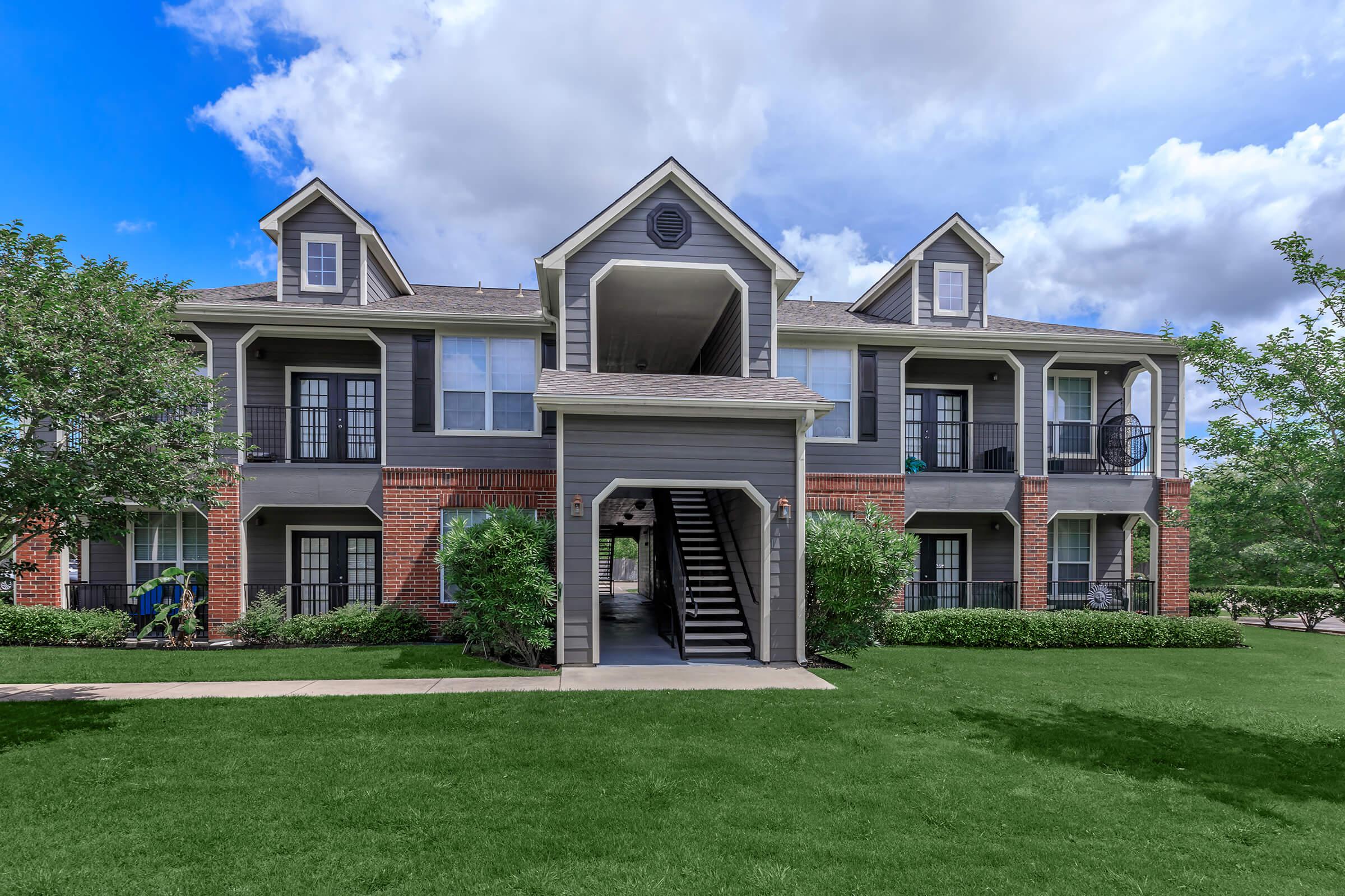 a large lawn in front of a house