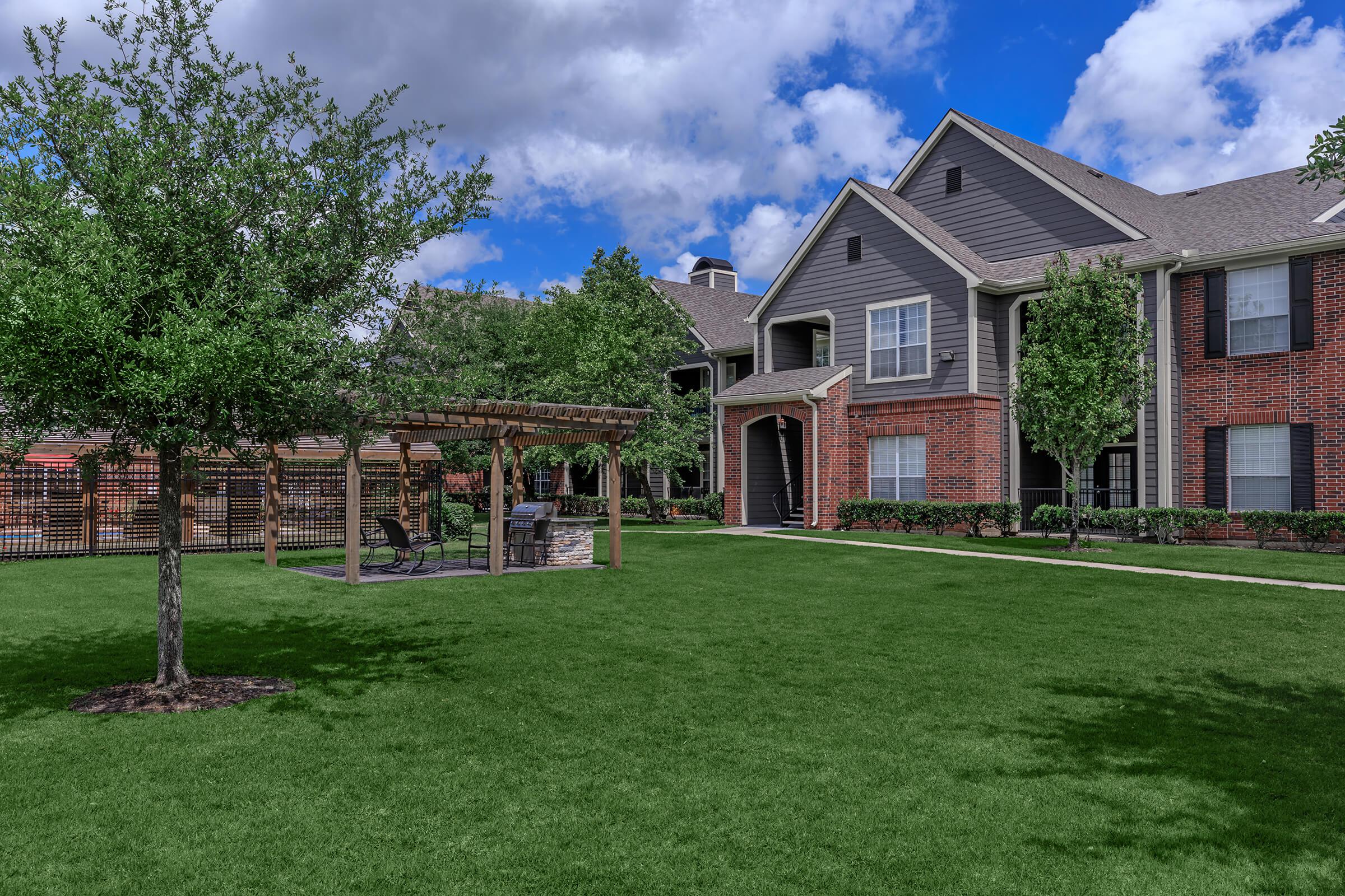 a large lawn in front of a house