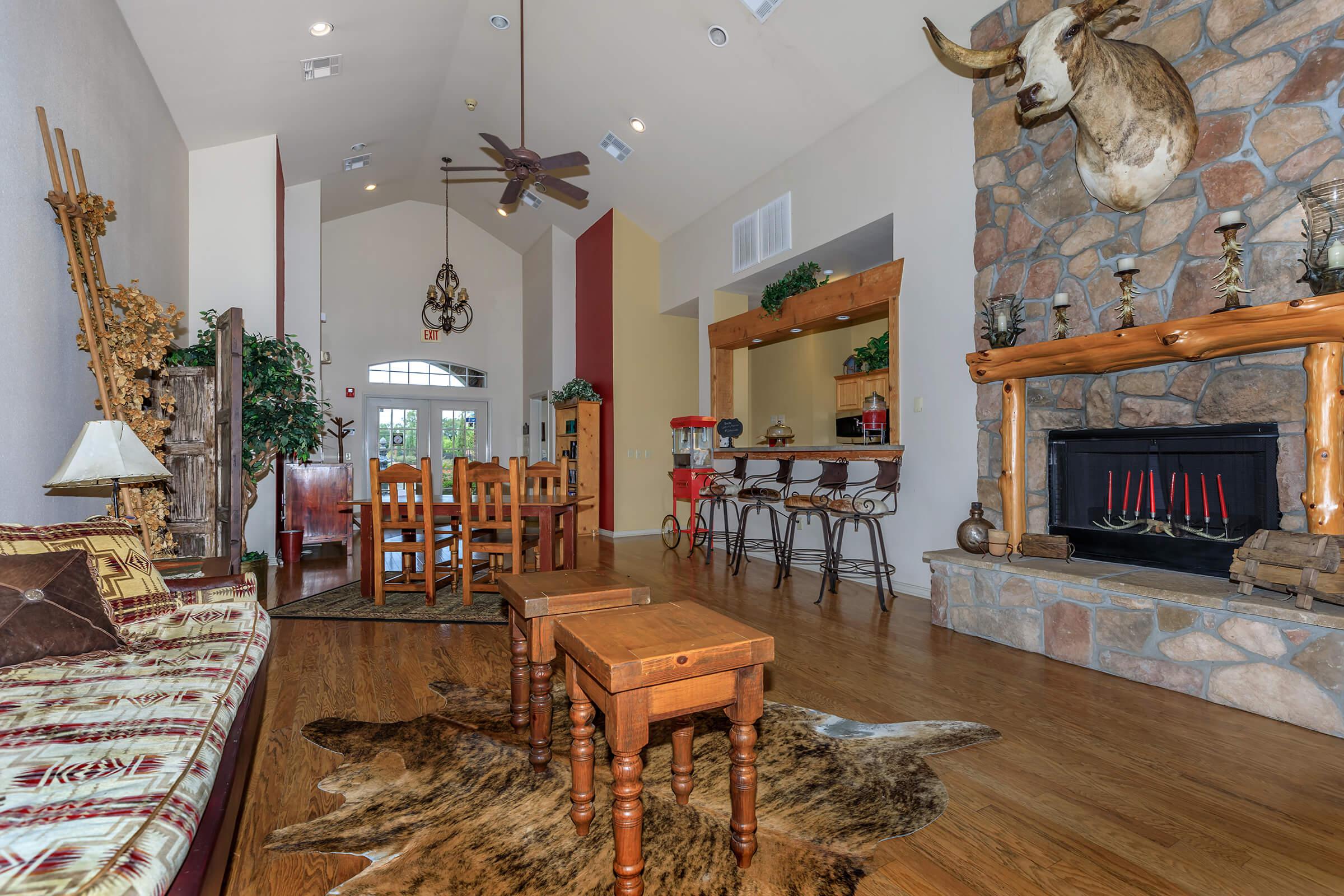 a living room filled with furniture and a fire place