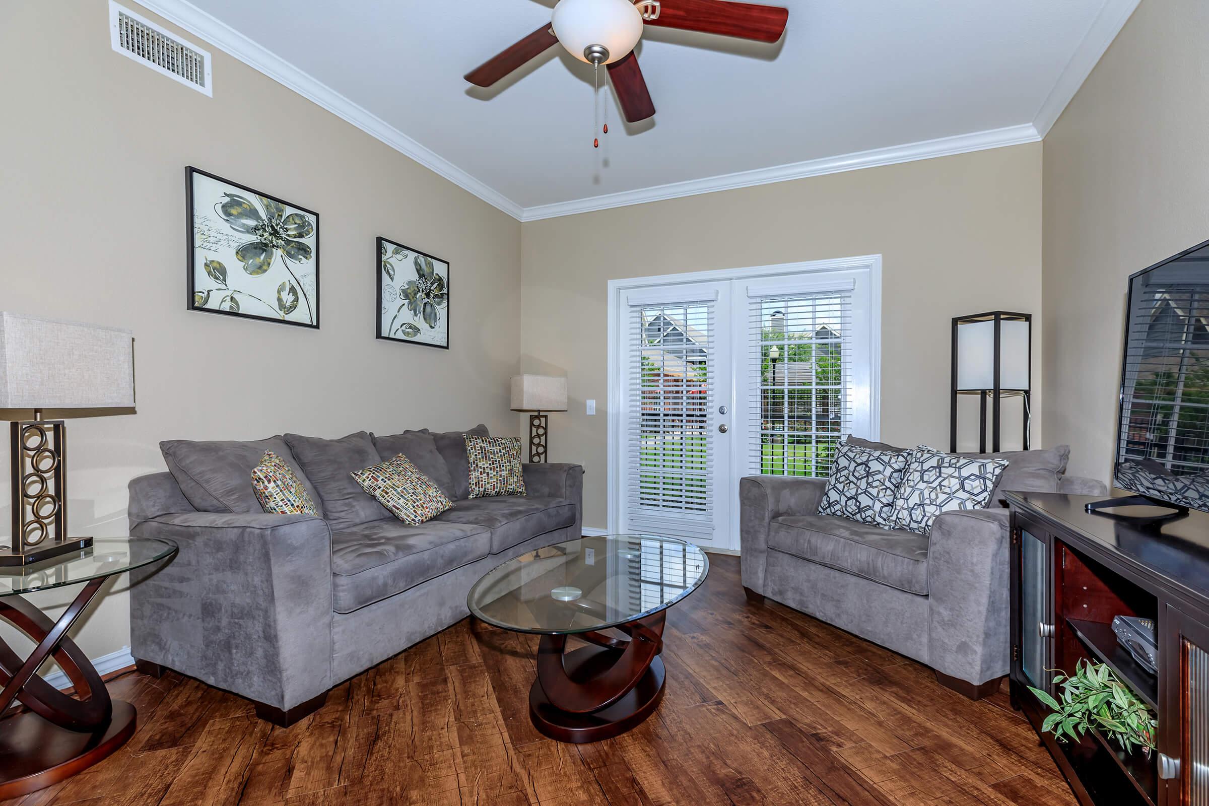 a living room filled with furniture and a fireplace