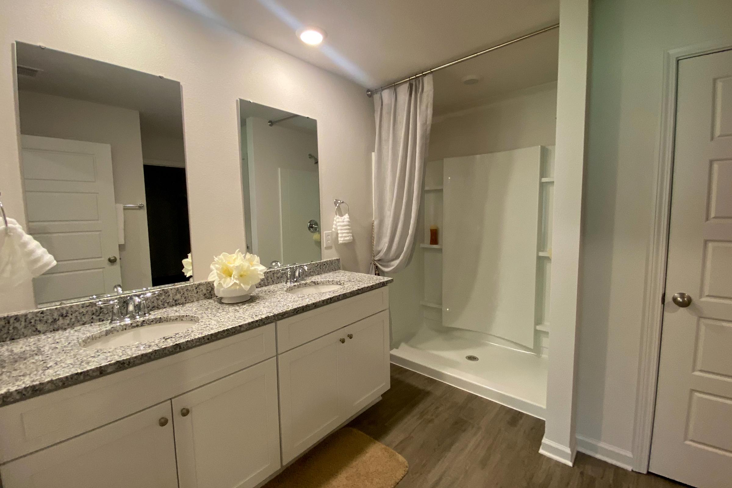 a kitchen with a sink and a mirror