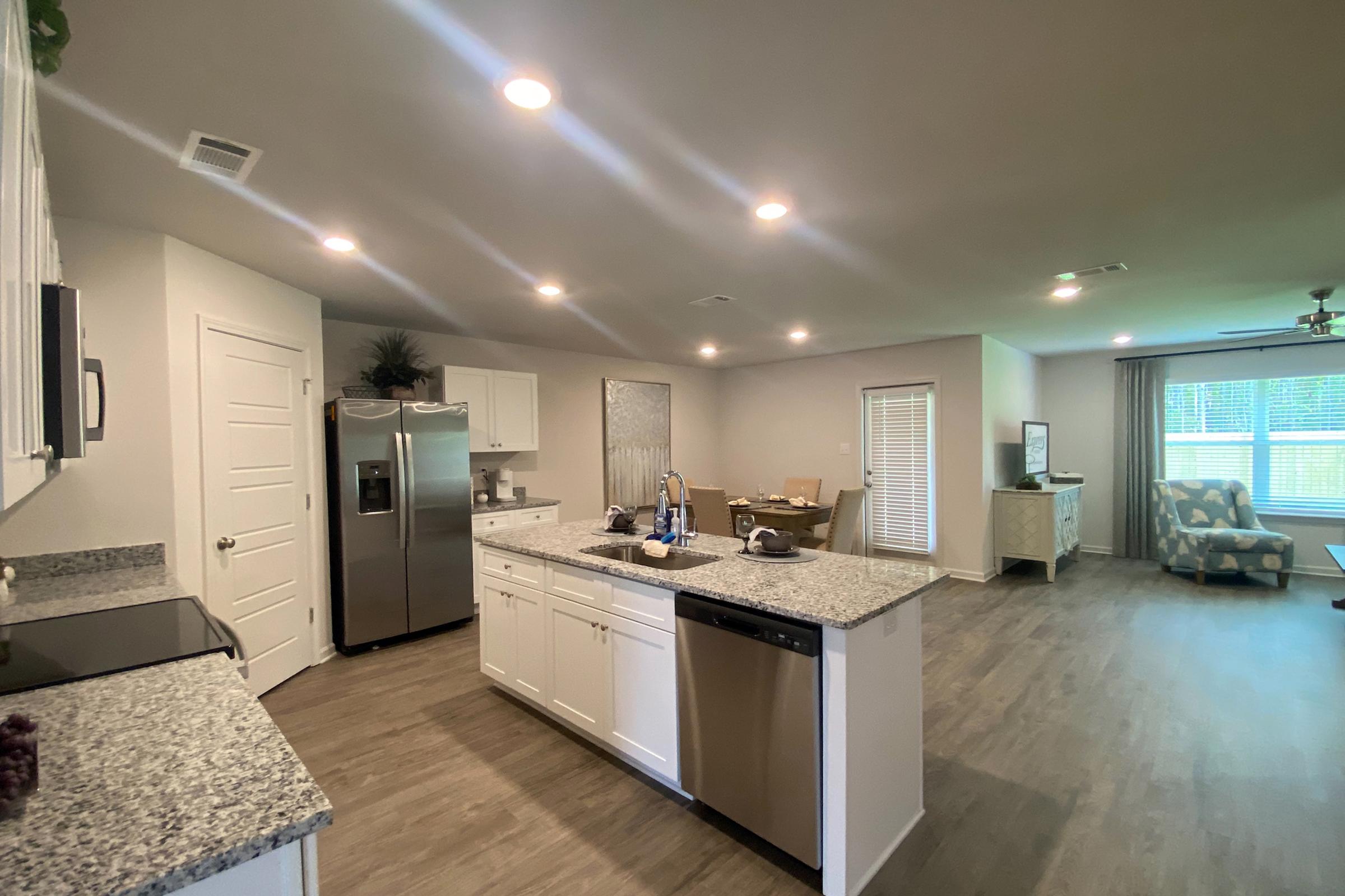 a kitchen with an island in the middle of a room