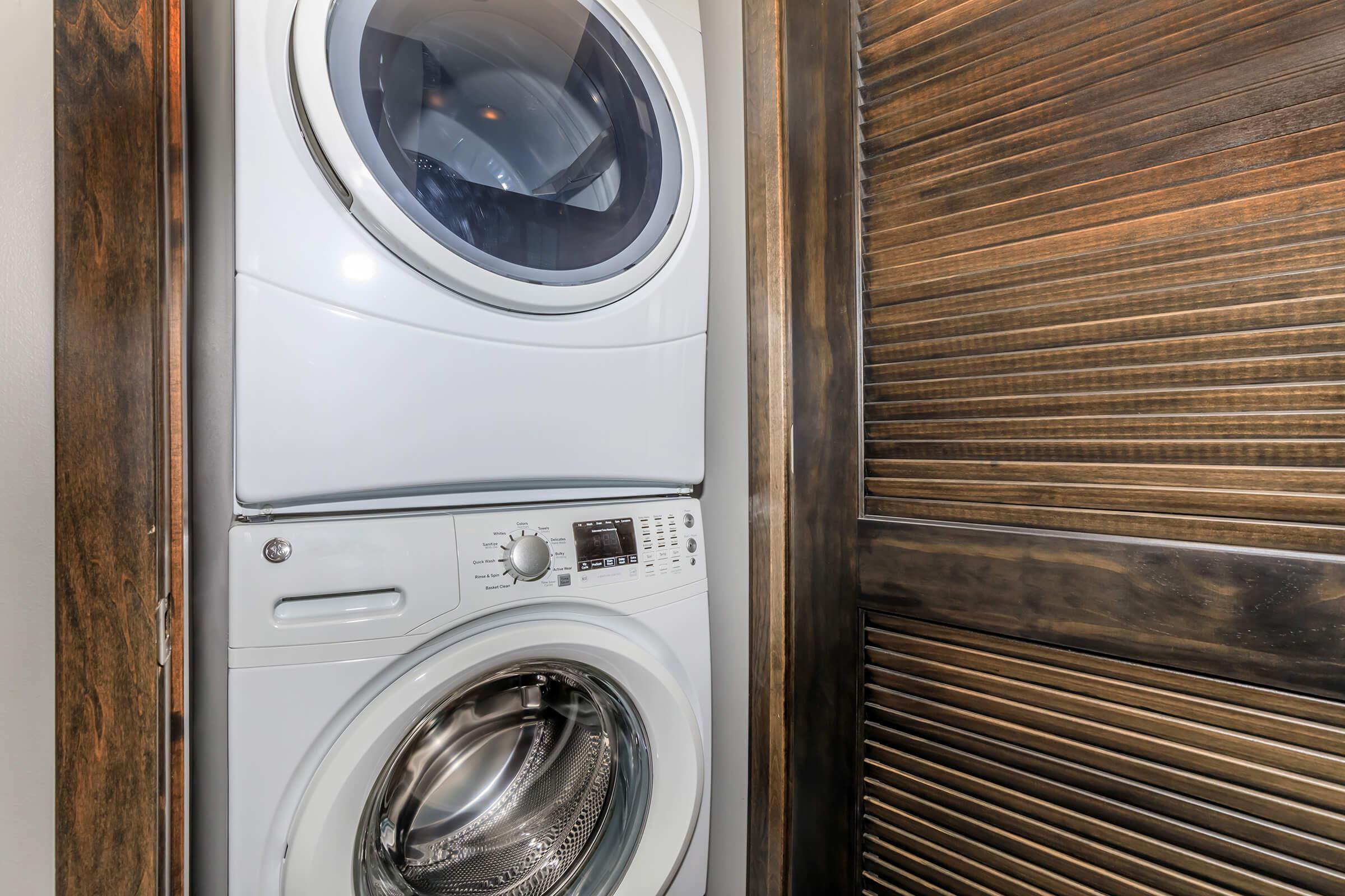 a washer and dryer next to a door
