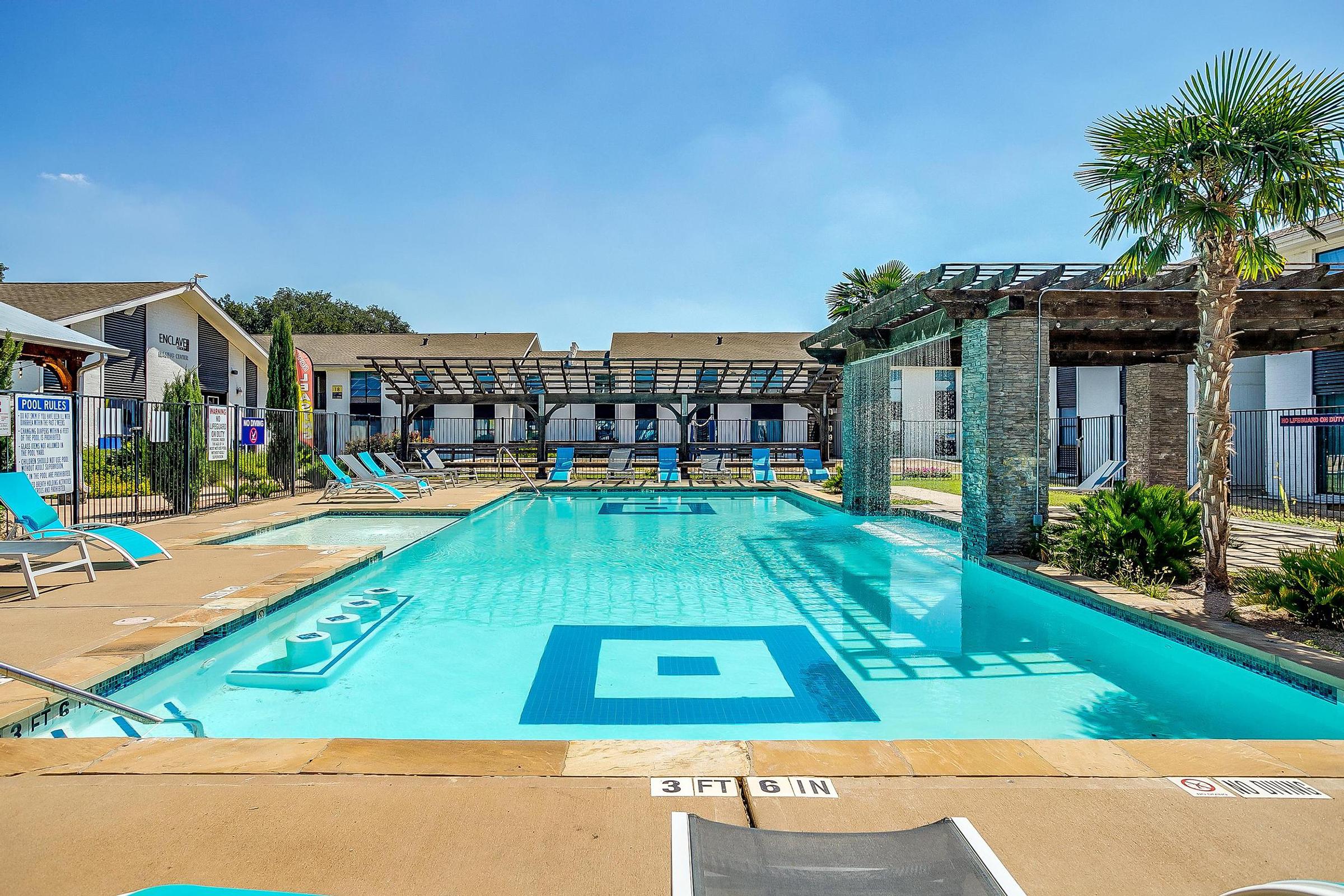 a house with a pool outside of a building