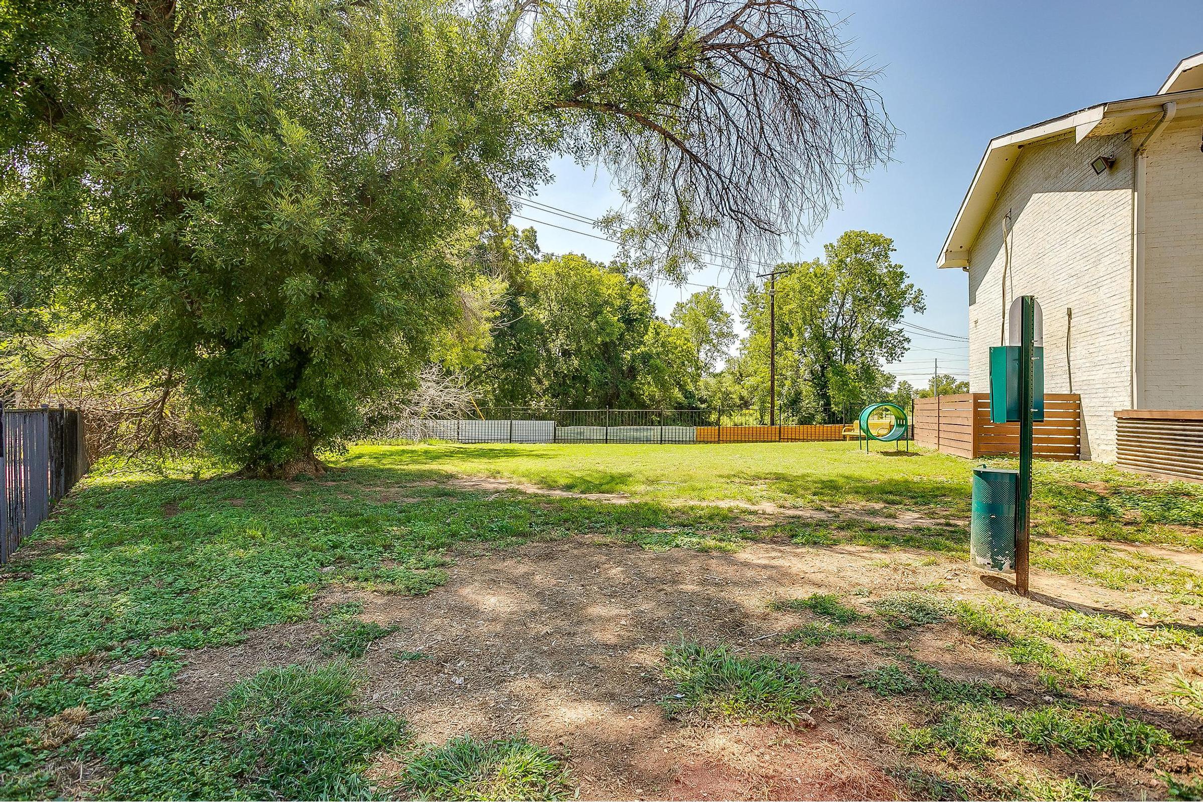 a tree in front of a house