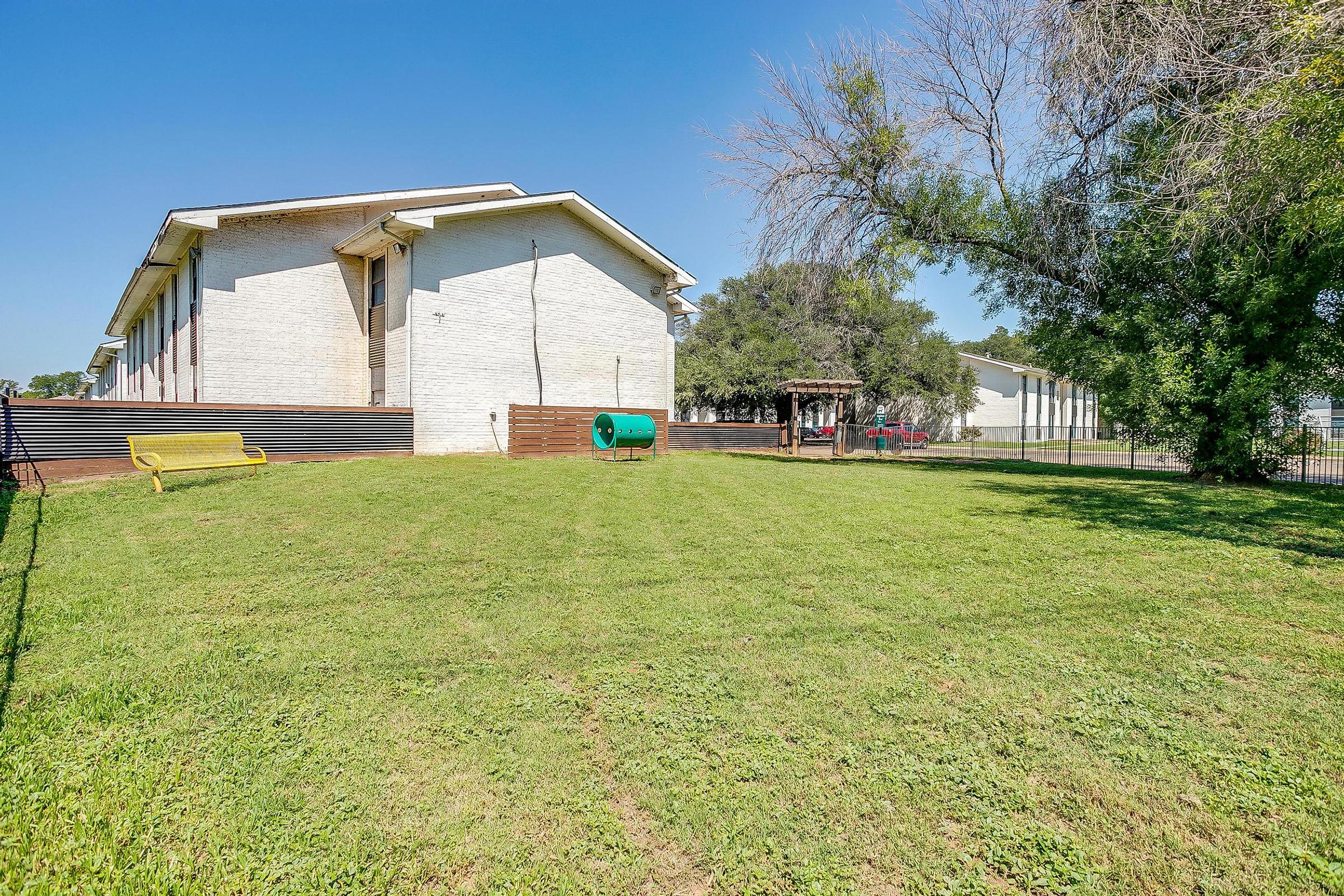 a house with a green field