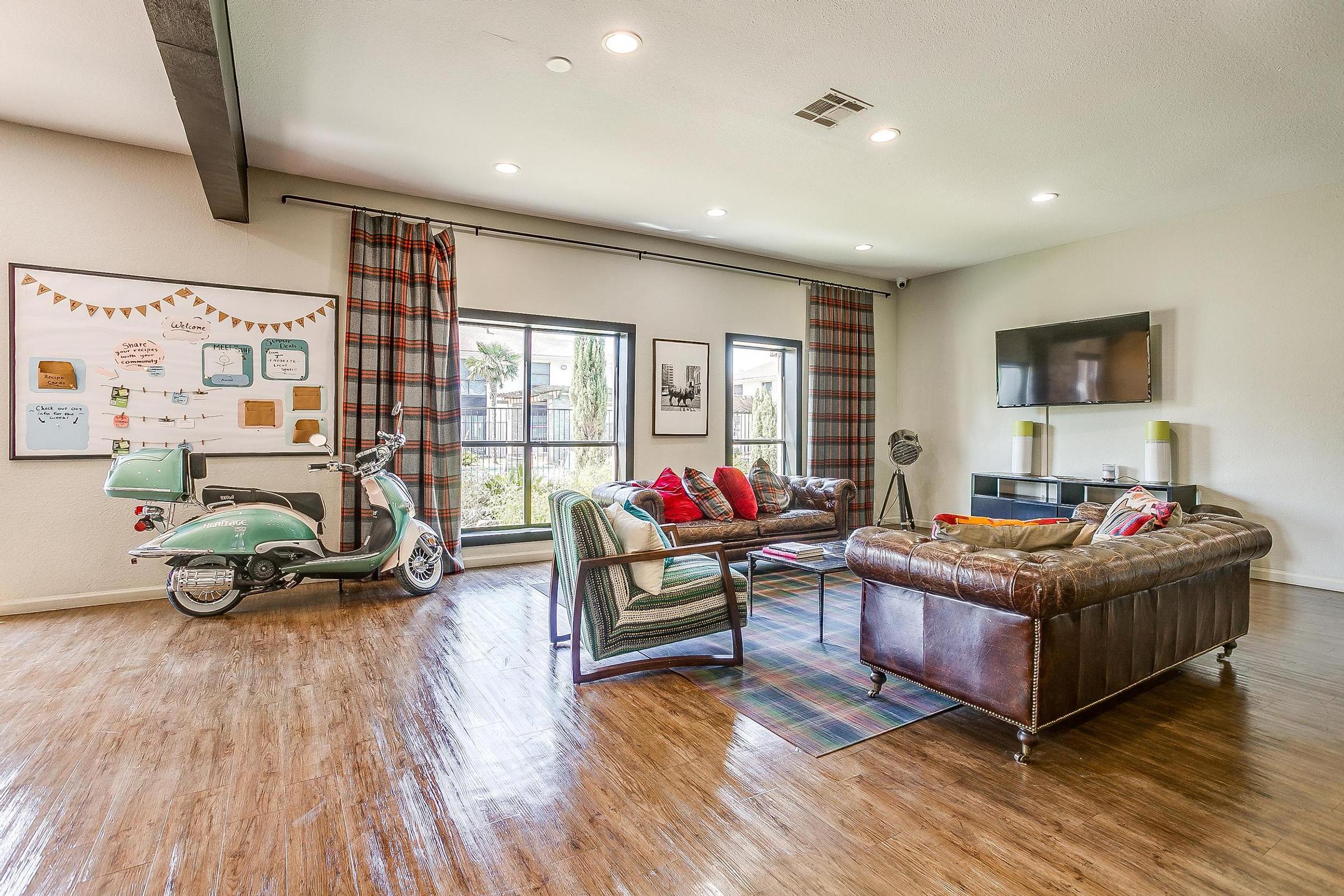 a living room filled with furniture and a large window