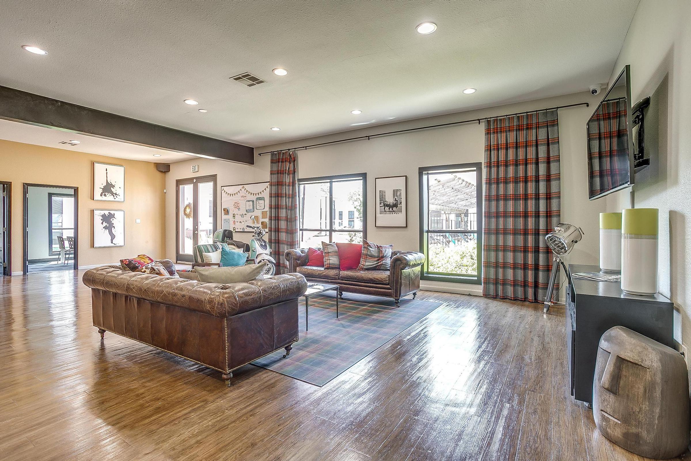 a living room filled with furniture and a table