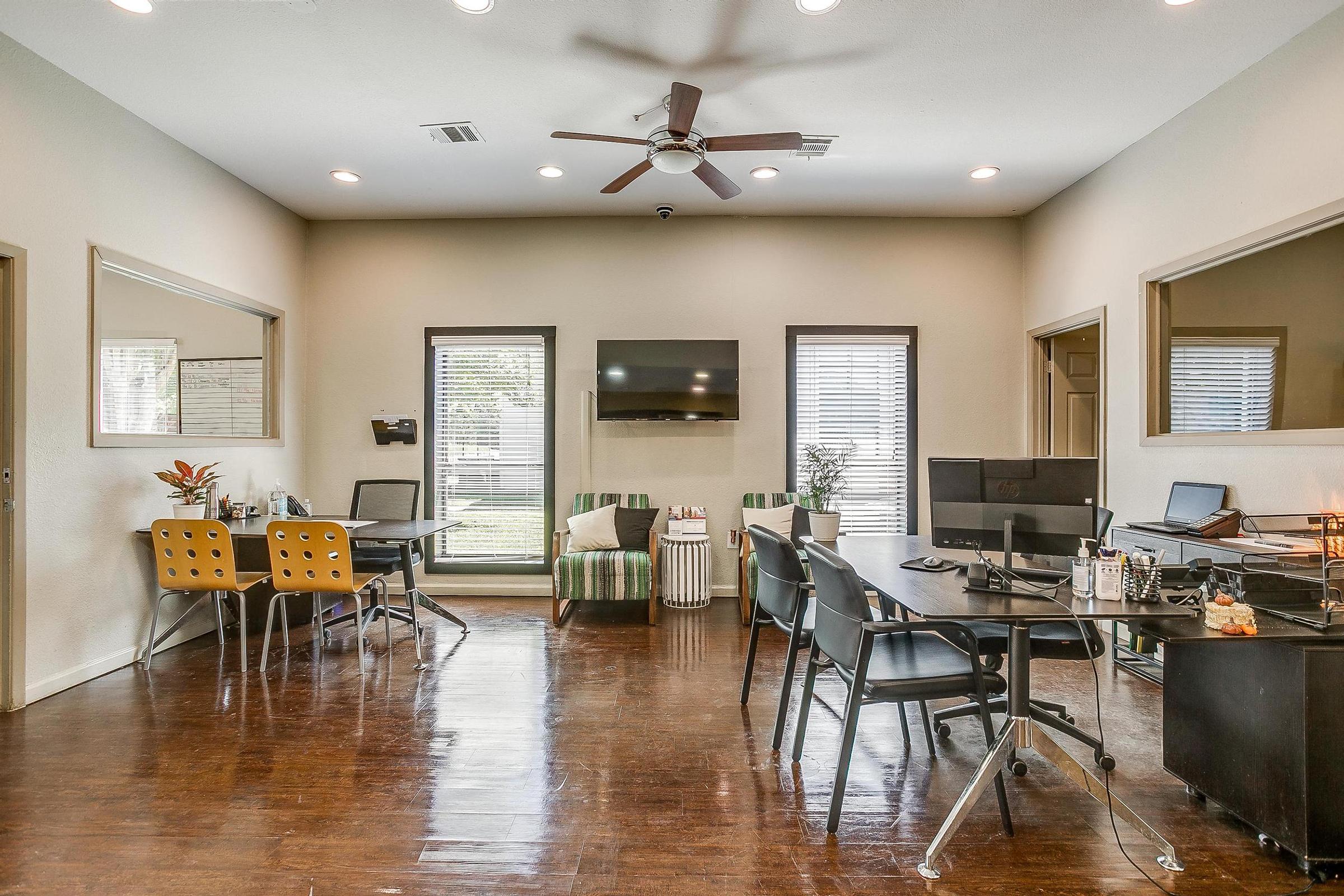 a living room filled with furniture and a table