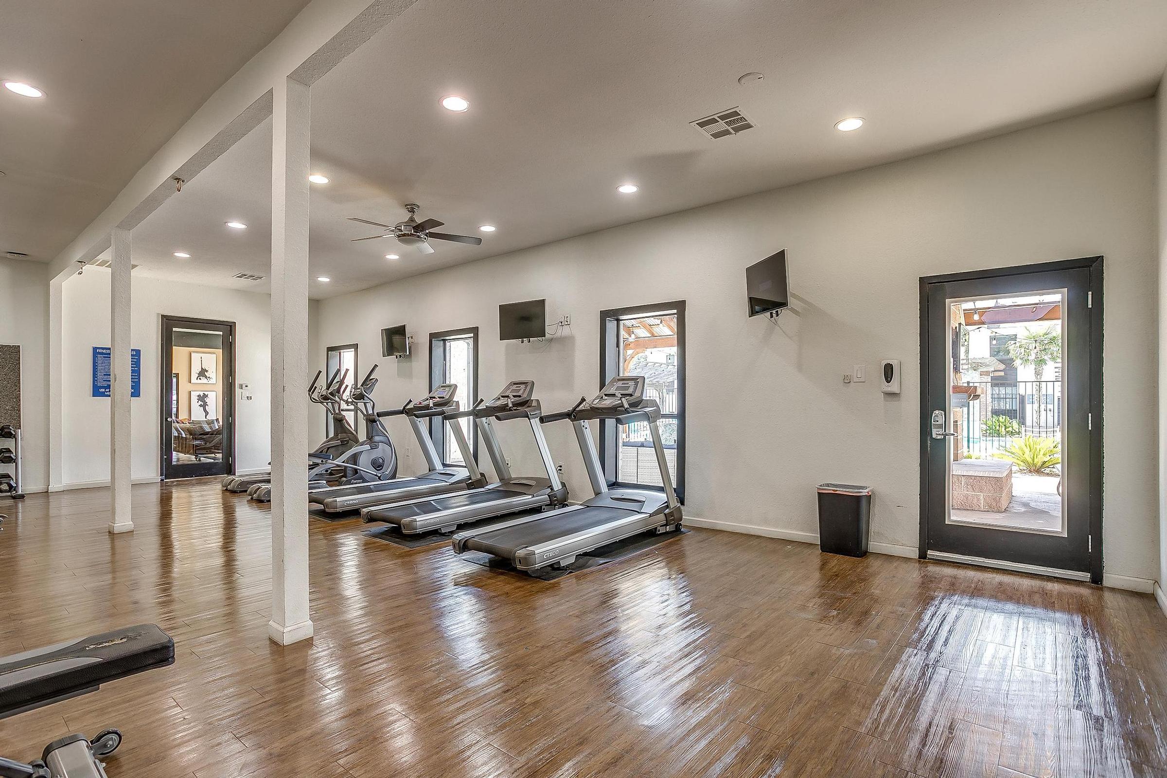 a room filled with furniture and a large window