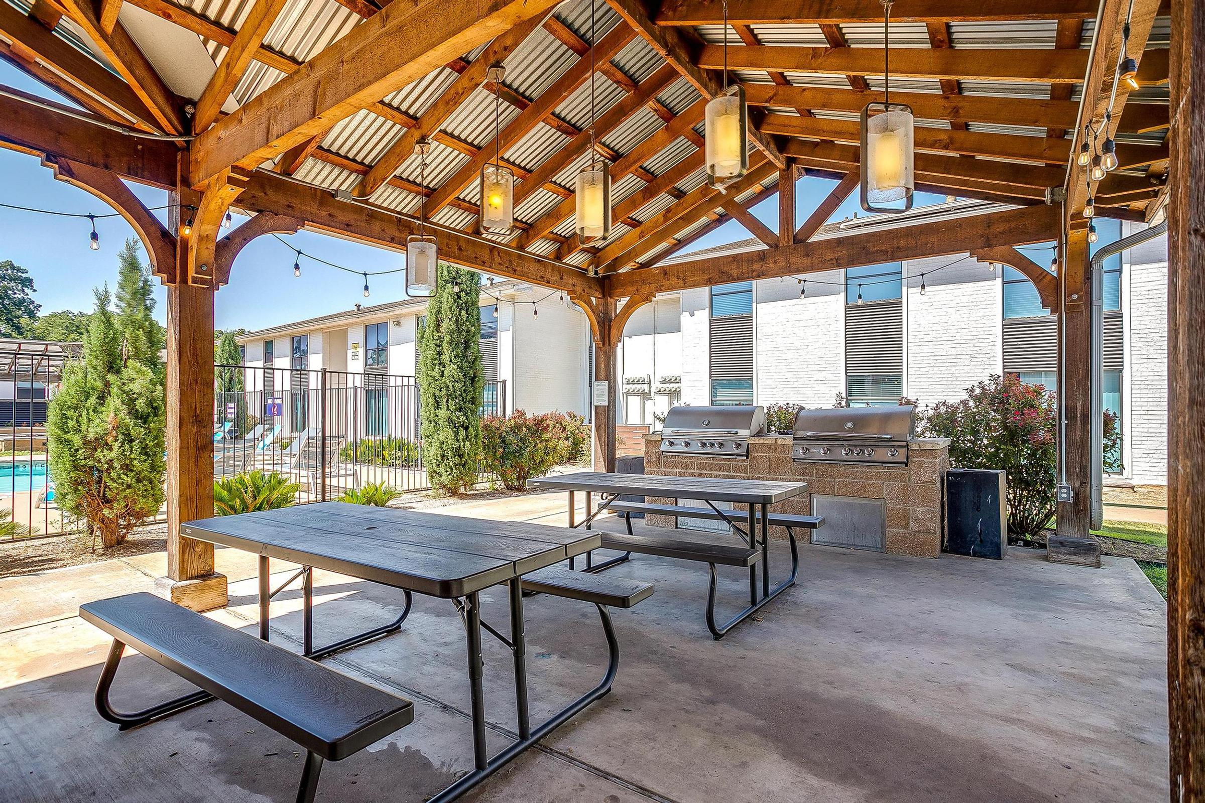 a wooden bench sitting in front of a building