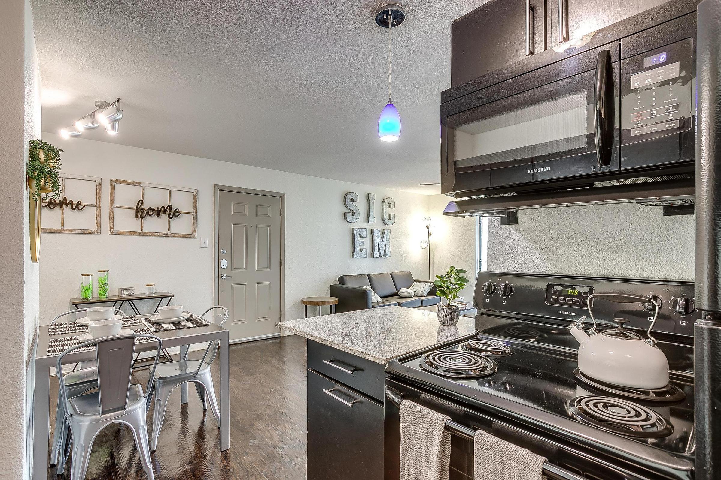 a kitchen with a stove and a sink