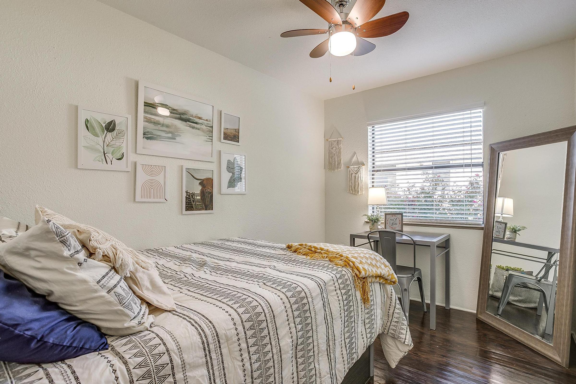 a bedroom with a large bed in a room