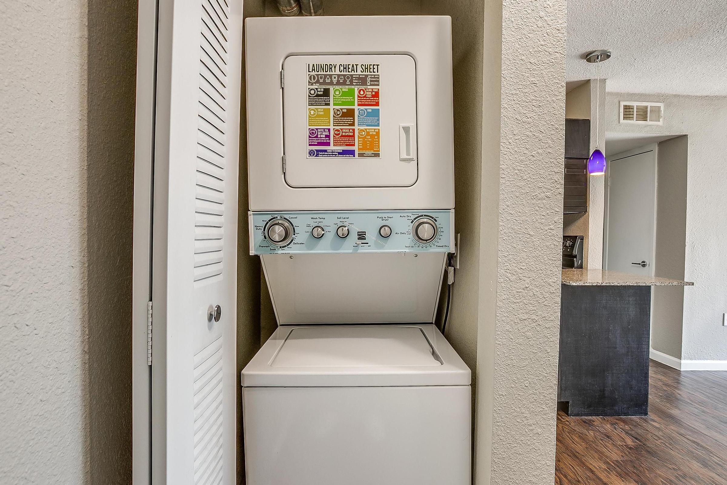 a refrigerator freezer sitting inside of a building