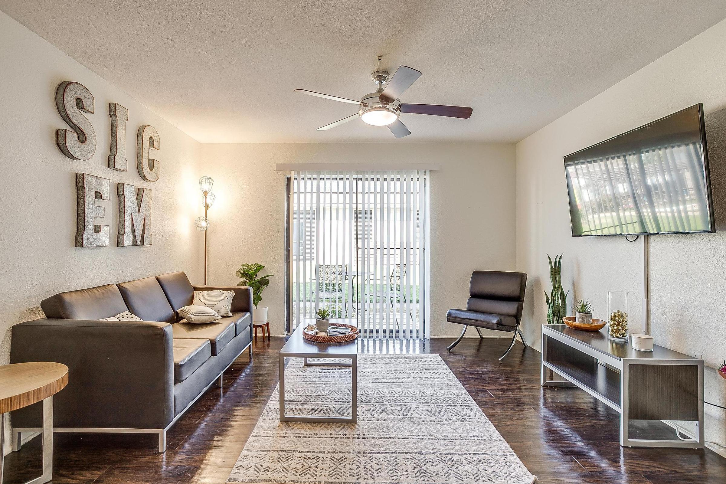 a living room filled with furniture and a fireplace