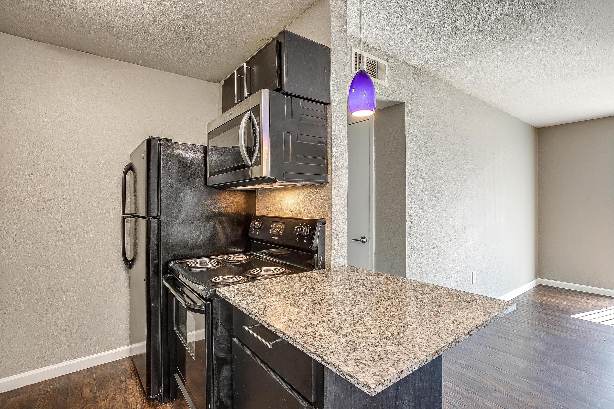 a kitchen with a stove and a sink