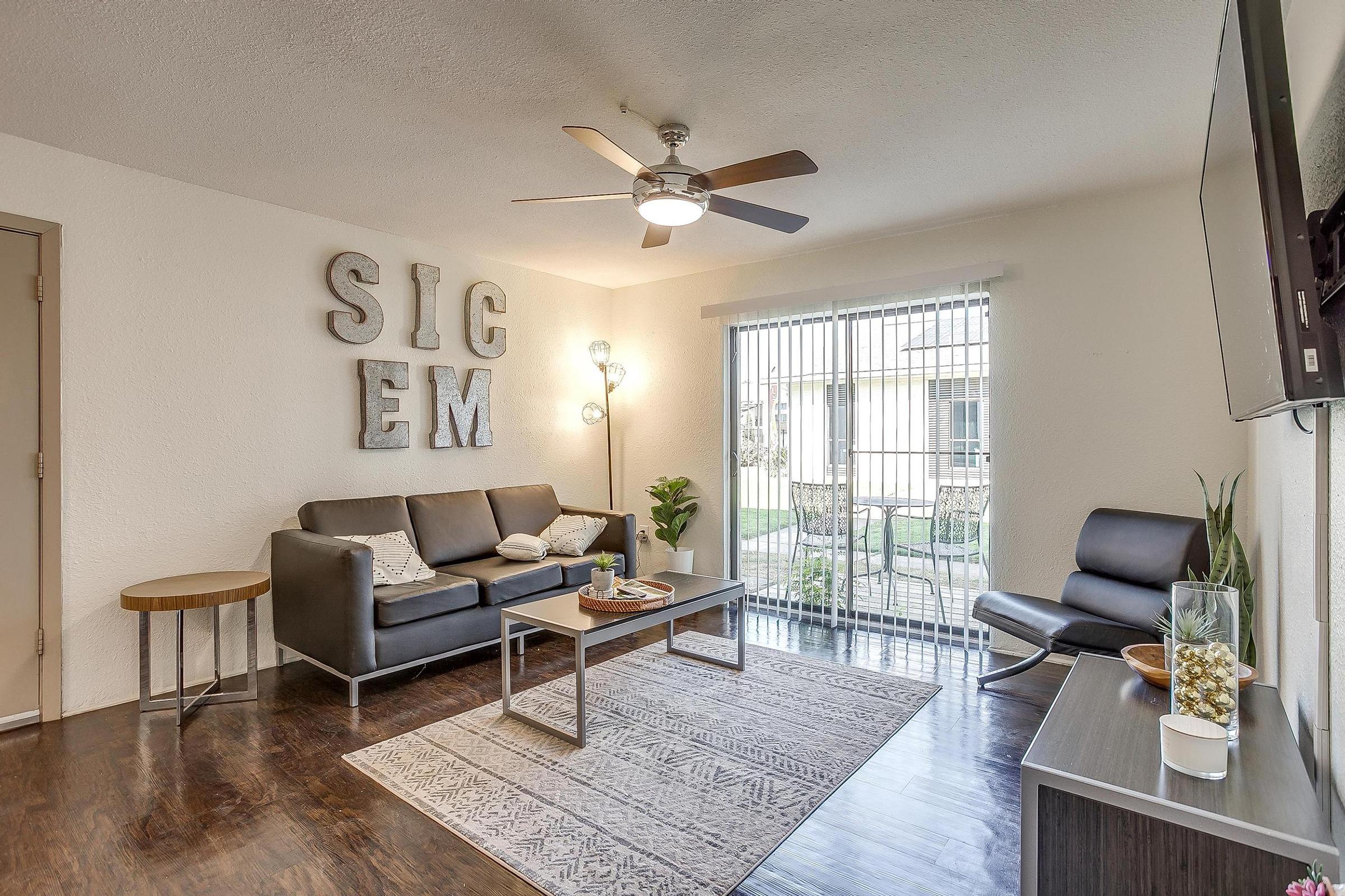 a living room filled with furniture and a window