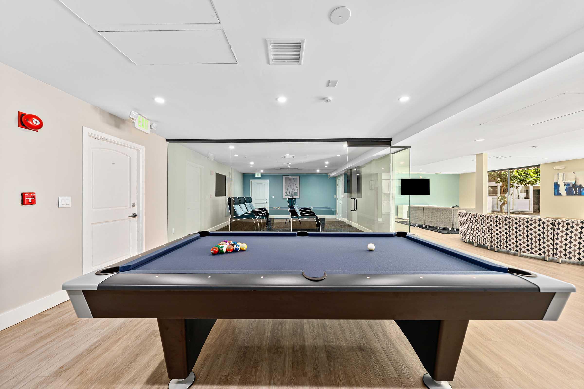 a pool table in a clubhouse