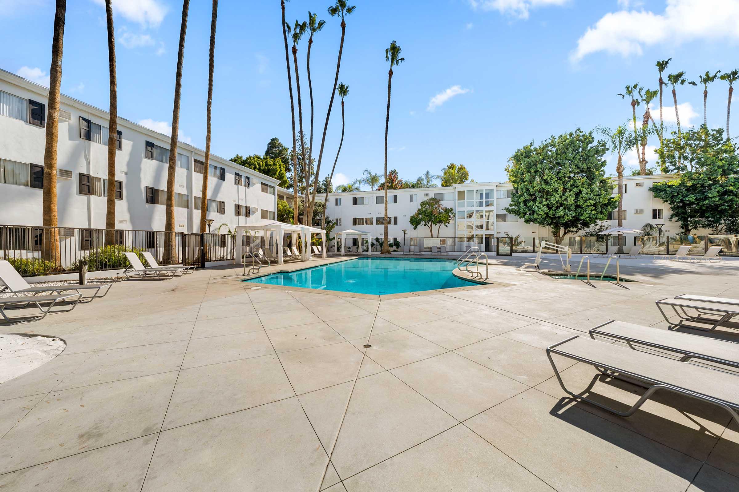 lounge chairs on a pool deck