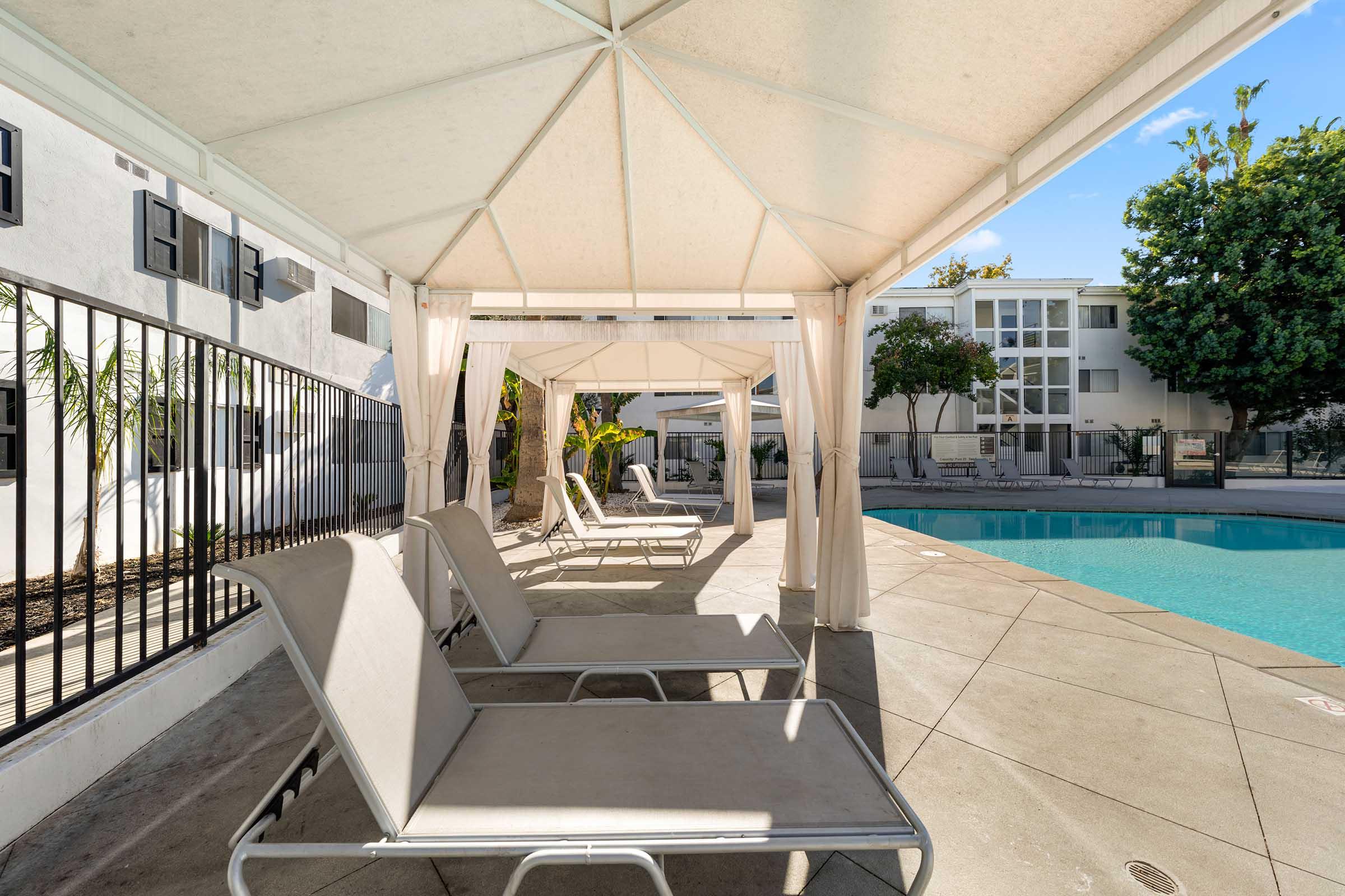 lounge chairs under a cabana