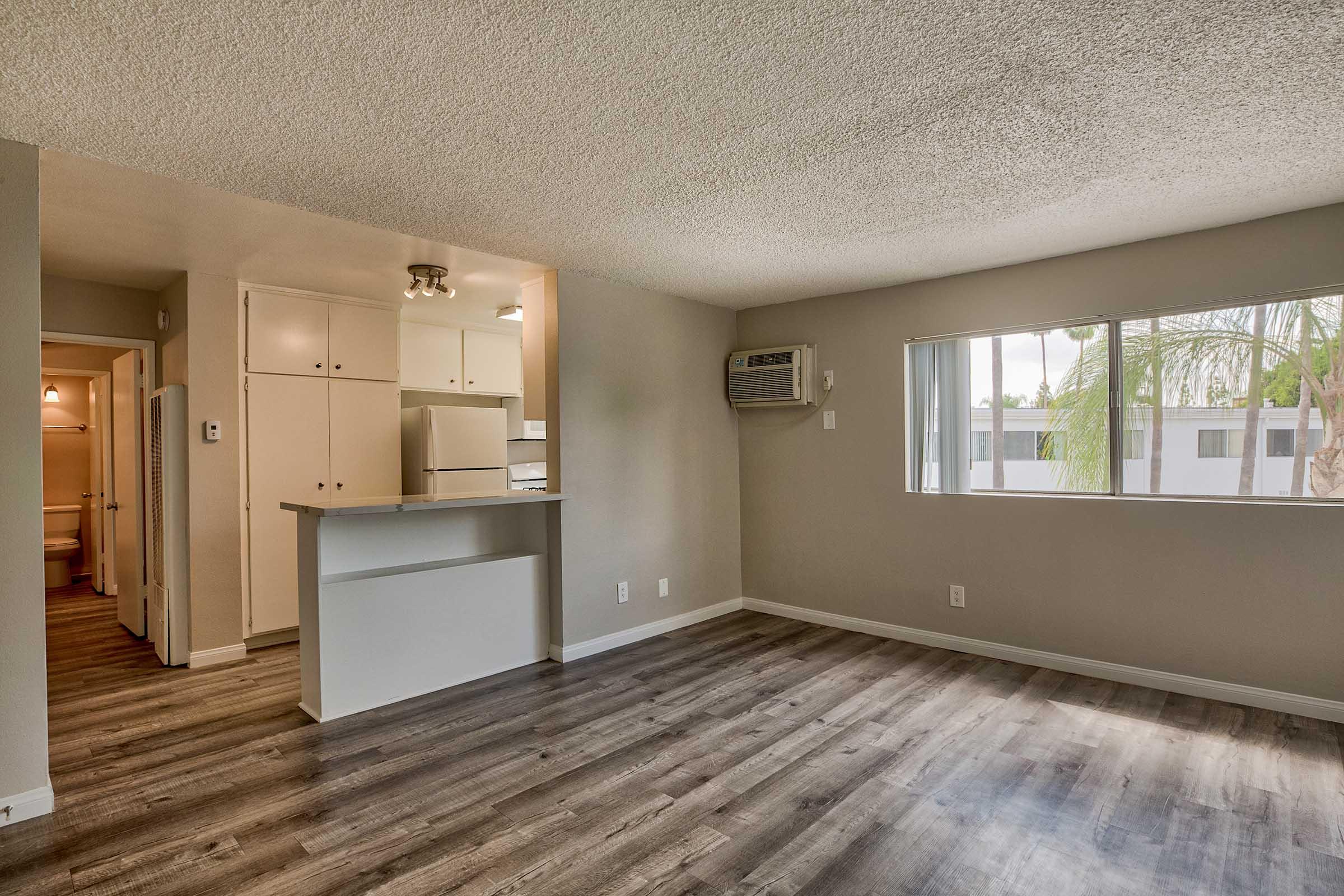 a large living room with an air conditioning