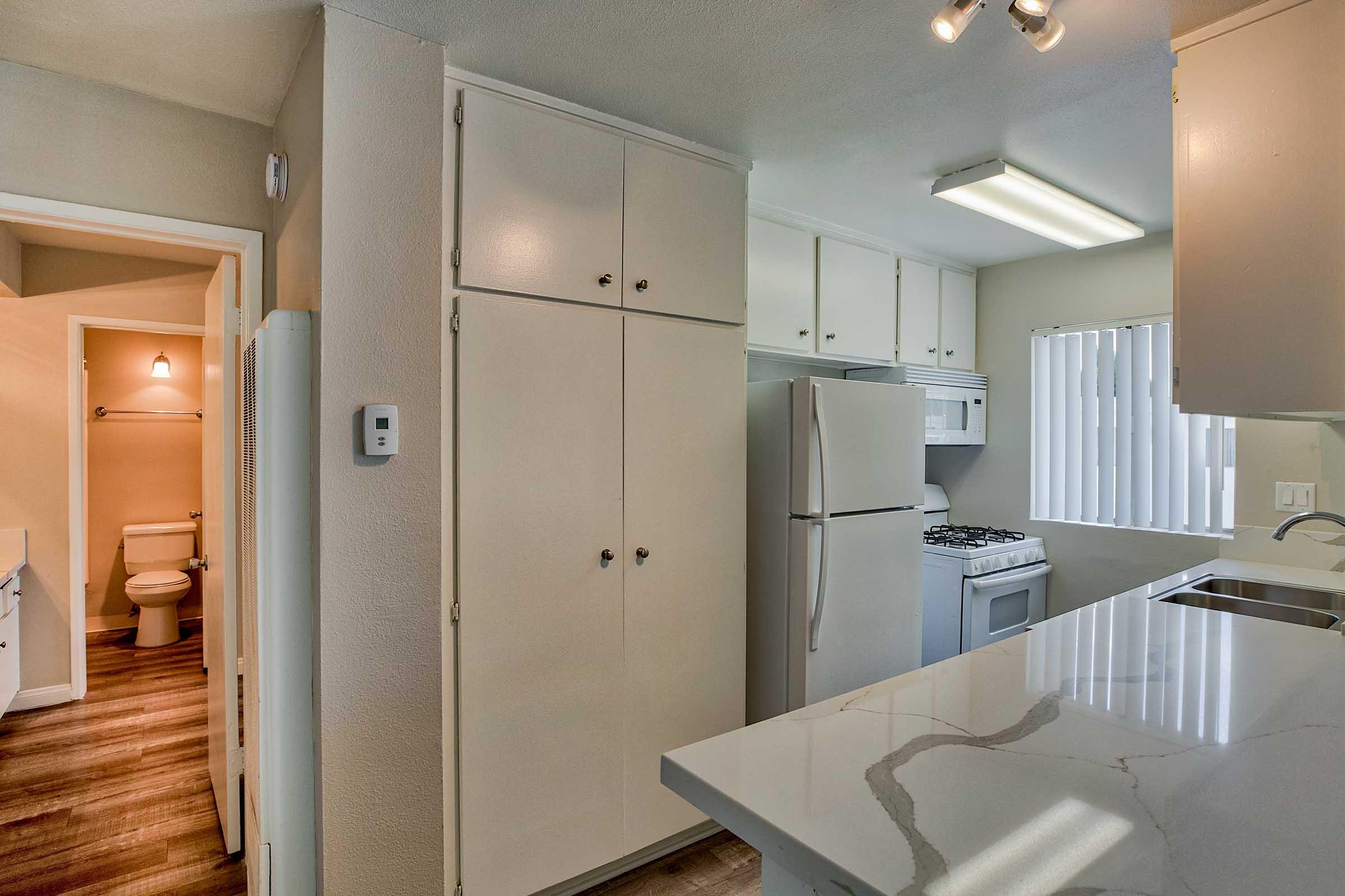 a kitchen with white appliances